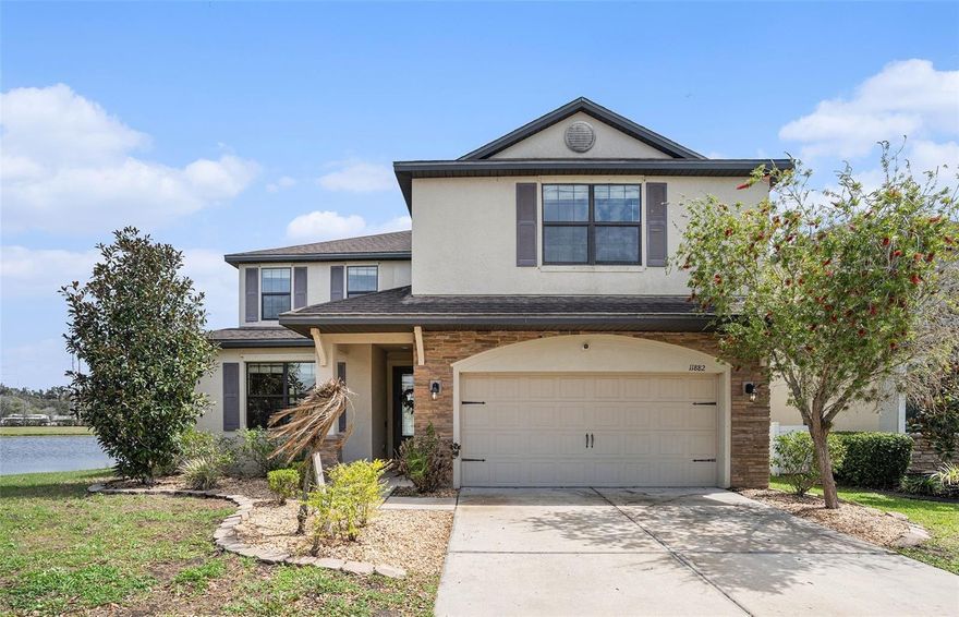 A Ballentrae Masterpiece! Welcome to 11882 Thicket Wood Rd, a stunning 5-bedroom, 3.5-bath pond-view home offering 2,906 sq ft of modern, contemporary living space. This beautifully designed two-story residence seamlessly blends comfort, style, and functionality. Step inside to a bright, open layout featuring a kitchen and family room combo, perfect for everyday living and entertaining. The chef-inspired kitchen boasts energy-efficient stainless-steel appliances, custom cabinetry, a large island, pantry, and breakfast bar, creating an inviting space for gatherings of all sizes. Upstairs, you’ll find a spacious and versatile bonus room, ideal for a media room, playroom, home office, or secondary living area. The thoughtfully designed floor plan provides ample room for both relaxation and productivity. Enjoy Florida living with open-concept interiors that flow effortlessly to a covered patio, overlooking tranquil pond views. Additional highlights include a 2-car-attached garage for secure parking and a beautifully landscaped front yard that enhances curb appeal. Residents of the Ballentrae community enjoy exceptional amenities, including a neighborhood pool, playground, and scenic walking trails winding through peaceful wetland conservation areas. Conveniently located near I-75, this home offers easy access to Tampa Bay’s top beaches, parks, dining, and shopping. This home truly has its all-space, style, and an unbeatable location.