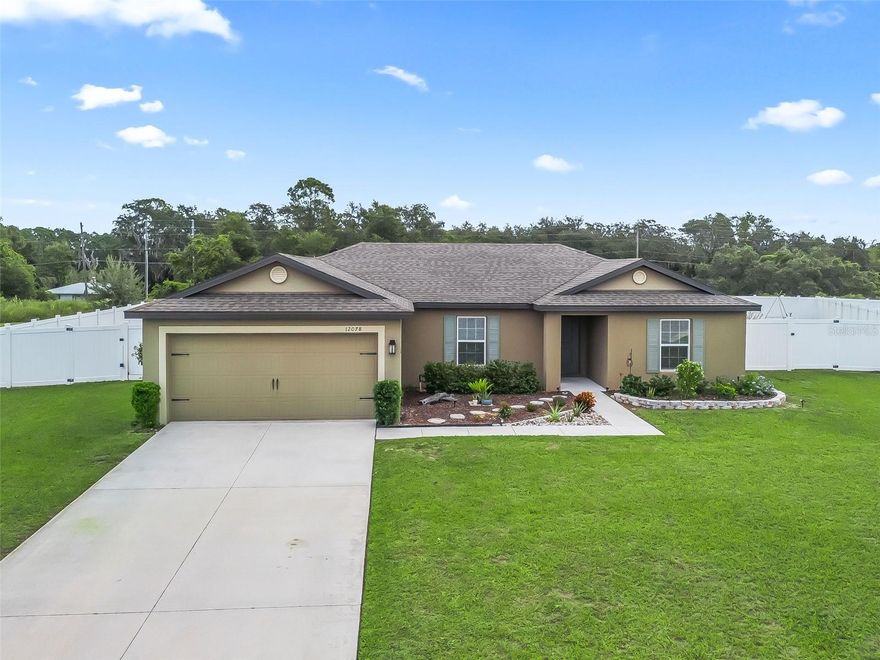 LOOKING FOR THAT PERFECT HOME WITH A COUNTRY FEELING AND NO REAR NEIGHBORS ON AN OVERSIZED .35 ACRE LOT IN A NICE NEIGHBORHOOD. WELL HERE IT IS.  CONVENIENTLY LOCATED TO EUSTIS, MT.DORA, TAVARES  AND EUSTIS.   FENCED IN BACKYARD.  THE WHOLE HOUSE HAS NEWER PORCELAIN TILED FLOORS THROUGHOUT WHICH WERE ADDED IN 2024, WITH NEW BASEBOARD IN 2025.  Spacious and open floorplan with kitchen overlooking family and dining areas. Kitchen features granite counter tops, large granite breakfast bar, stainless steel appliances and corner walk-in pantry.  Sliding glass doors in family room to backyard.  The primary bedroom has walk-in closet, en-suite bath, quartz countertops and walk-in shower. Split plan with two nice size bedrooms with guest bath and 2 linen closets in hallway on right side of home.  Interior laundry room with washer and dryer.   Backyard fenced in with vinyl fencing for privacy with plenty of room to add pool, play area for children, garden and swing set. With the home being at the end of the road on a cul-de-sac, you will not have any through traffic which makes this location a rare find!!! Chain of lakes access close by if you enjoy boating, or a trip to Mt.Dora to antique shop.  Make your appointment today to view this lovely home