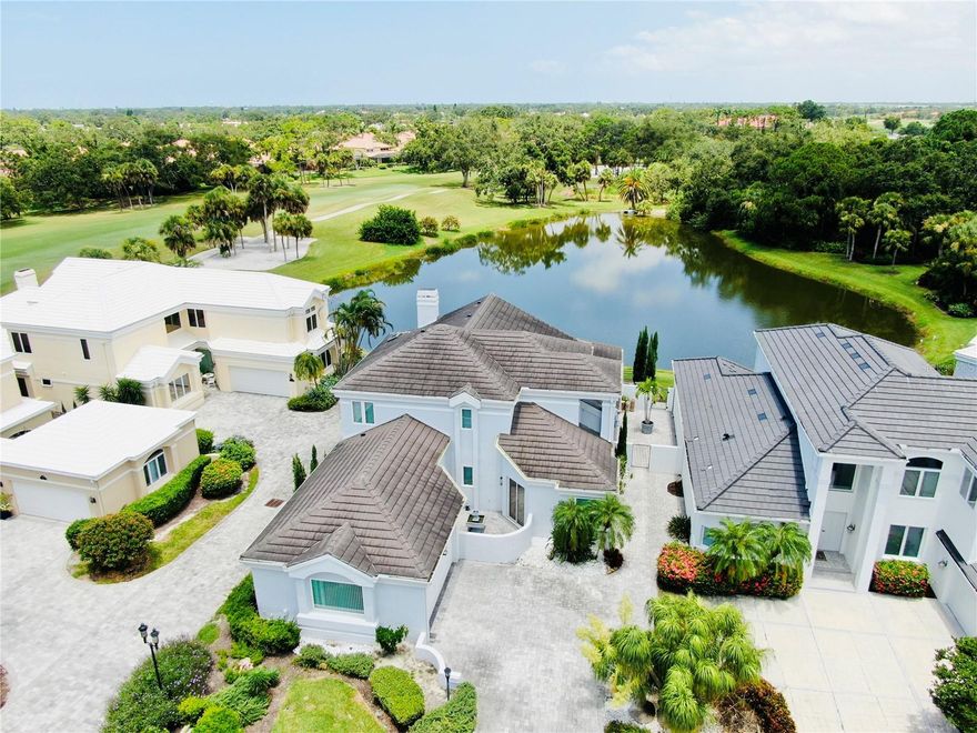 Modern Elegance with Golf Course Views in TPC Prestancia

Set within the gated community of TPC Prestancia, home to Sarasota’s only TPC golf course, this custom two-story residence offers refined design and serene views along the 10th fairway. The home welcomes you with soaring ceilings, a graceful mahogany staircase, and Wenge hardwood floors. A 20-foot Jerusalem-stone fireplace anchors the main living area, framed by expansive windows overlooking the golf course and lake.

The chef’s kitchen features Sub-Zero and Wolf appliances, double ovens, wine cooler, custom cabinetry, and a butler’s pantry with coffee bar. The primary suite includes a spa-style bath with dual vanities, soaking tub, body-spray shower, bidet, and custom walk-in closet with direct patio access. Two additional ensuite bedrooms provide comfort and privacy, including a main-level suite ideal for an office or guest room. Upstairs, a bonus/media room with wet bar expands the living space.

Outdoor living includes a private courtyard with fountain and convenient access to the community pool across the street. Optional golf and social memberships available. Located minutes from Siesta Key Beach, Legacy Trail, and Sarasota’s cultural, dining, and shopping destinations.