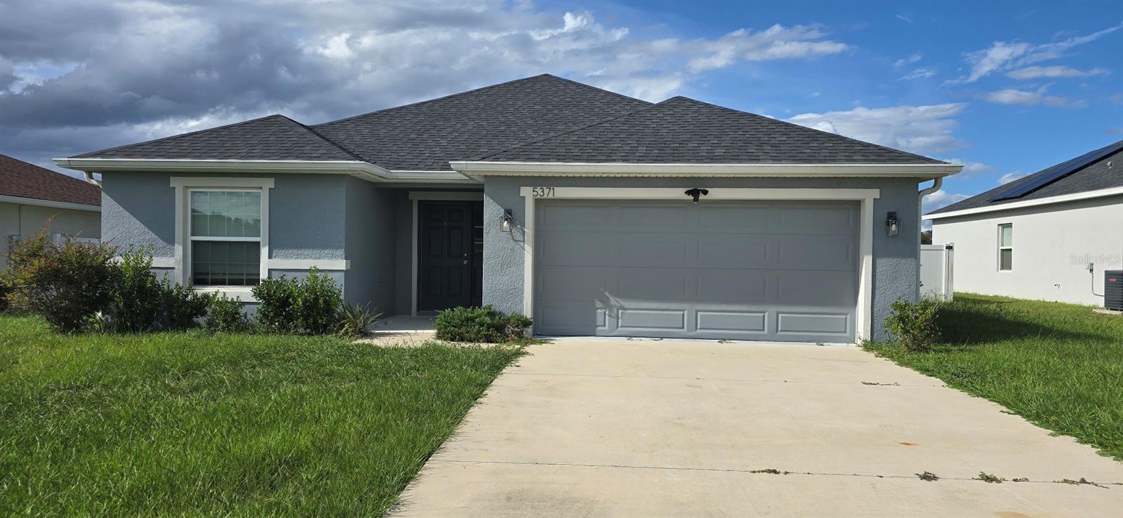 Home features durable luxury vinyl plank flooring in living areas, kitchen, and bathrooms. Open floor plan with large kitchen island and family dining, screened lanai, and vinyl privacy fence. 3 bedrooms, 2 bathrooms, plus a den.