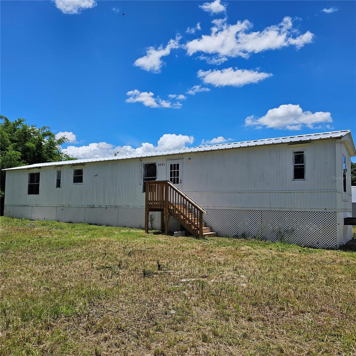 3 bedroom 2 bath on double lot partially fenced needs some tlc, does have new kitchen, new bathroom, new metal roof, new ac and new well equipment. Come take a look see if its for you.