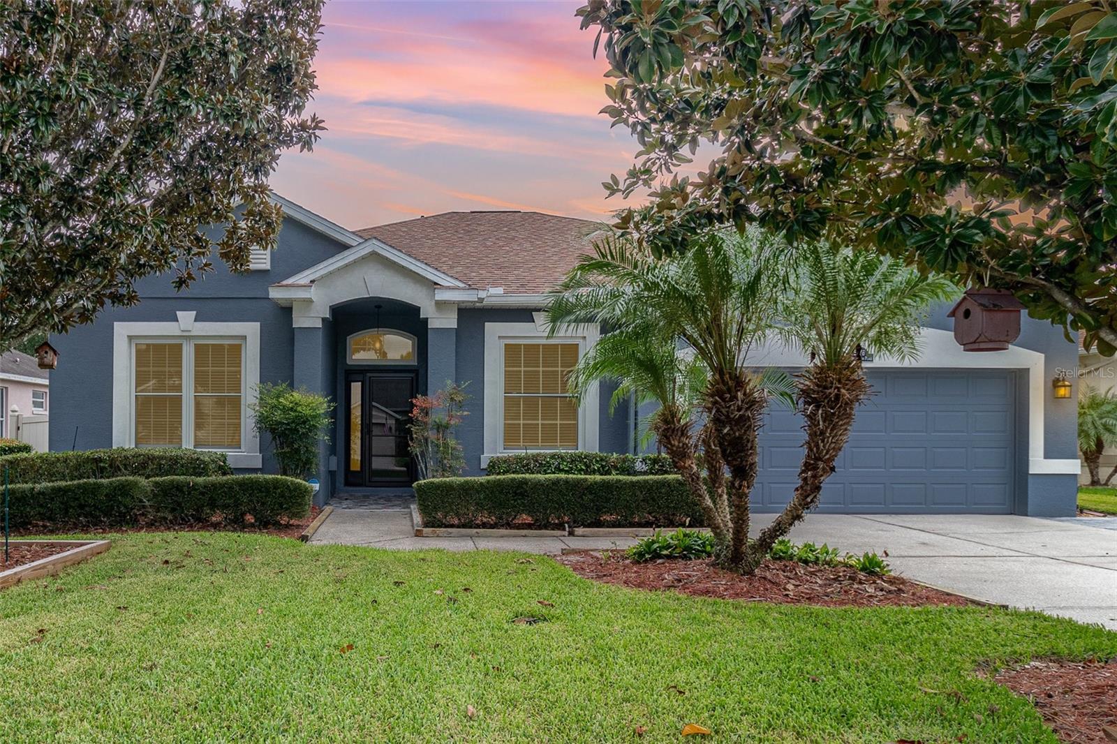 Welcome into this BEAUTIFUL, MOVE-IN READY, 4/2 Oviedo POOL home located in the highly desirable GATED community of CYPRESS HEAD AT THE ENCLAVE! This home is a wonderful combination of recent CONTEMPORARY UPGRADES GALORE and functionality for comfort. Step inside to a spacious, open-concept, formal living room with tons of serene natural light and high ceilings. This thoughtfully designed split bedroom plan provides privacy for family and guests. The primary bedroom is a retreat of its own offering a walk-in closet and private bathroom with dual sinks, granite countertops and separate tub and shower. The other 3 spacious secondary bedrooms are located on the opposite side of this ONE-STORY home providing utmost privacy. The FAMILY ROOM & KITCHEN COMBO are the heart of the home boasting gorgeous views of the covered, paver lanai and inviting bright blue POOL. Your private, fenced backyard oasis offers professionally installed artificial turf for low maintenance and year-long beauty. The chef's kitchen offers STAINLESS STEEL APPLAINCES, GRANITE COUNTERTOPS, solid wood cabinets, eat-in space, breakfast bar and plenty of counter space. A separate dining room is conveniently located next to the kitchen for seamless access and provides the perfect space for larger, formal gatherings with friends and family. Enjoy the convenience of an attached, 2-car garage and professionally WIDENED PAVER DRIVEWAY! This home also offers a bonus WATER SOFTENER & WATER FILTRATION SYSTEM! UPGRADES INCLUDE: (2018) ROOF, DOUBLE-PANED/STORM RESISTANT WINDOWS, METAL FRONT DOOR, PET PROOF/STORM DOOR & backyard PVC FENCING. (2014) HVAC. (2021) LAMINATE WATERPROOF FLOORING, BASEBOARDS, INTERIOR WALL PAINT, GRANITE COUNTERTOPS & KITCHEN BACKSPLASH. (2022) LG STAINLESS STEEL KITCHEN APPLIANCES, EXTENDED ROOF of COVERED LANAI-13.5 feet, POOL REMODEL (including equipment, marcite and tile) & EXTERIOR WALL PAINT. Conveniently located with easy access to A+ Rated Seminole County Schools, 417, UCF, Downtown Orlando and TWO International Airports. HURRY IN!