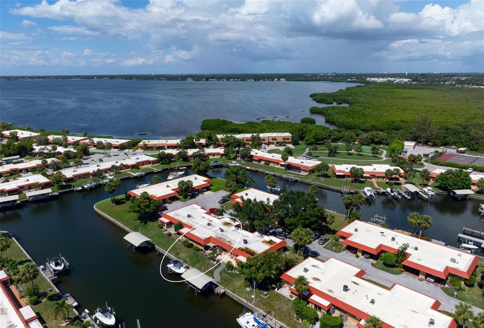 PRIVATE DOCK WITH 7000 POUND BOAT LIFT!! CURRENTLY RENTED AND RENTER CAN STAY FOR ANOTHER YEAR OR MOVE OUT SO YOU CAN MOVE RIGHT IN. RARELY available 1 bedroom, 1 bathroom condo in Palma Sola Harbour, a gated, waterfront community located less than three miles to the pristine sugary sand beaches. MONTHLY DUES ARE ONLY $675 PER MONTH AND INCLUDE FLOOD INSURANCE!!!!No fixed bridges to get out to Palma Sola Bay!! This spacious floorplan features ceramic tile throughout, a huge bedroom and oversized walk-in closet. Step out to your bright and airy patio and catch the sunset...you may even see some Manatees and a dolphin or two. A separate laundry room features a washer and dryer and extra storage. Currently there is a long-term renter in the condo who can stay or move prior to closing. Please ask for details. Palma Sola Harbour features two heated swimming pools, tennis/pickleball courts, a putting green, a workshop with tons of tools, an exercise room, billiards room, two Swedish type saunas, a clubhouse that hosts community activities, an onsite manager, and pets are allowed, including large dogs. Close to shopping, restaurants, and the Village of Cortez. This truly is your perfect piece of Paradise.