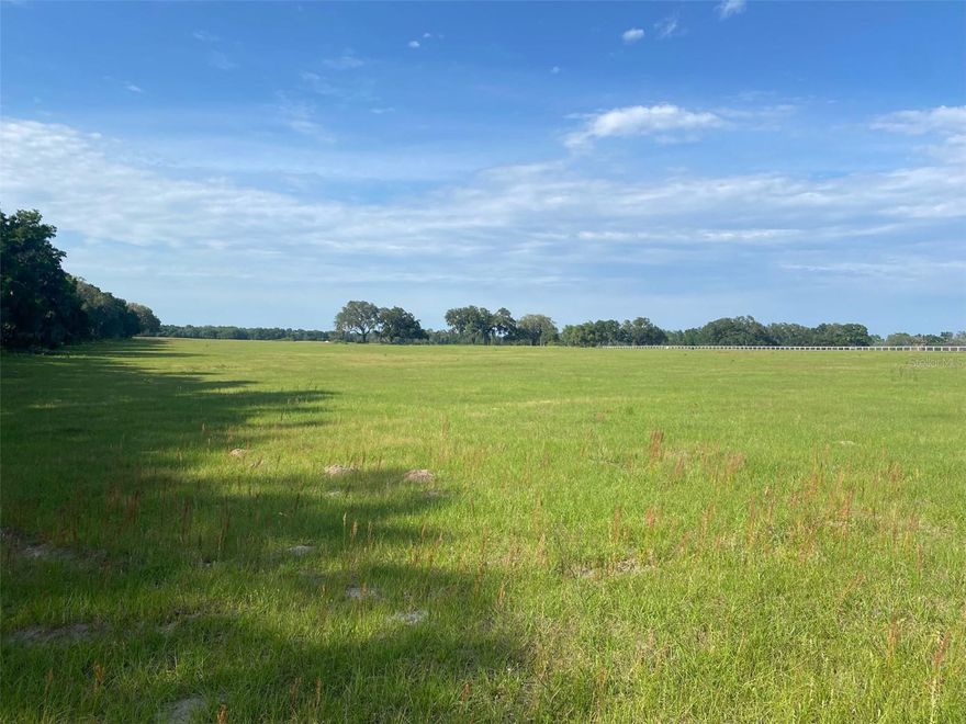 Beautiful 11.12 acre tract in Emerald Ridge, a deed restricted equine community.  Improved pasture with scattered live oaks.  One of only 8 tracts in this community.