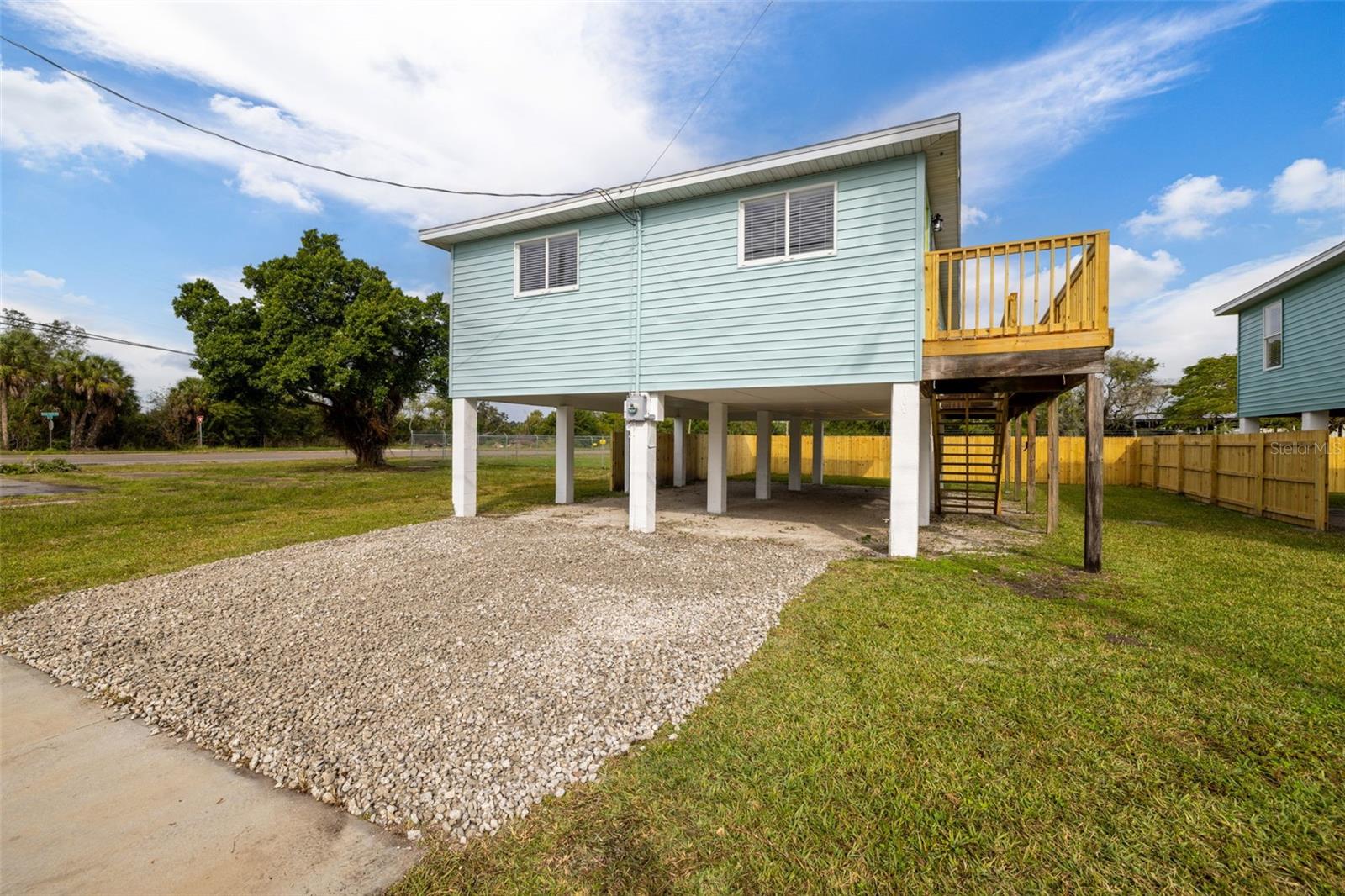 NO HOA, NO Deed Restrictions, NO CDD! Upgraded Remodeled home by a Professional Designer Team! This concrete elevated home offers low Insurance Rates due to it has 3.5 yr old Roof 2021, New AC , New Hot Water Heater, New high-end Samsung Stainless Appliance package, New Quartz Counters in Kitchen & Bathrooms, New 42” Cabinets! New Wide Plank Luxury Waterproof Floors throughout! Your Deck offers outdoor Entertaining! Foyer Entry opens to Stunning Kitchen with high-end fixtures showing off their abilities! The Kitchen offers plenty of 42” Cabinetry, Quartz Counters with a Designer Selected Back Splash! The Kitchen Window offers a bright uplifting space that will be treasured! The Great Room offers many Windows with New Custom Blinds throughout! Design your Great Room to include your needs in this big space! The Full Guest Bath is completely new including the Cabinetry, Quartz Counters, Sink, Brushed Nickel Faucet, New Tub with Tile you will love! Hand Selected for you and Professionally Installed! The Laundry Room is a dedicated room you will love! The new Energy Efficient AC System and Hot Water Heater are in the laundry room so there is plenty of space to design it to fit your needs! The Master Bedroom is opposite from the Secondary Bedrooms with a Walk in Closet & Remote-Controlled Ceiling Fan! Master Bathroom En Suite offers New Vanity, New Sink, New Toilet and a Stunning Walk-in Shower adorned in Tile hand-selected for you! There are 2 Secondary Bedrooms that also have Remote Controlled Ceiling Fans! The interior and exterior was just painted and all Light fixtures are New! The newly 6’ Privacy Fence offers you the privacy and the opportunity to use the storage under the house! The Yard is good size and has no HOA dictating your obligations! You can park your business truck, trailer, Boat or anything that would typically cost you additional money to store! Quick access to Bayshore gets you to St Pete, south to Bradenton or north to Apollo Beach with ease! If you are a Boater the water access is close, so you don’t have to go far to enjoy yourself! Come take a look at the upgrades and Design and tell us what you think! Come see all 3 homes, 1008, 1006 and 1004 72nd St Ct E and take your pick of colors and design! OPEN THE VIRTUAL TOUR – MATTERPORT THAT ALLOWS YOU TO WALK THROUGH THE HOUSE IN REAL TIME! TAKE A LOOK!