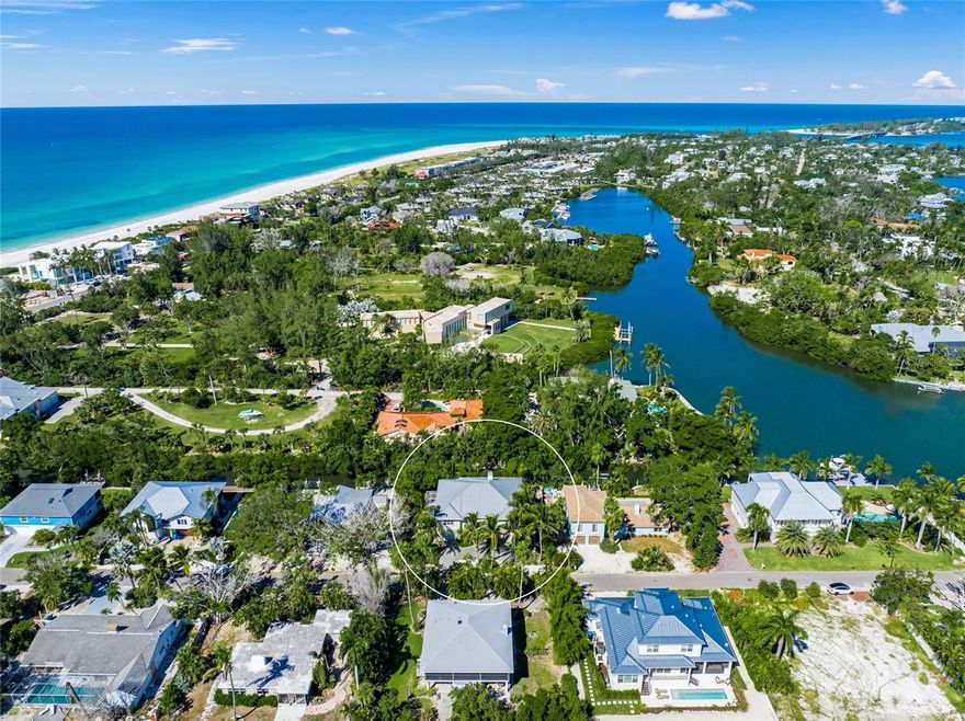 Live the ultimate Florida Waterfront lifestyle in this private, calm, secure, spacious and elegant large elevated coastal home.  Located on the North end of Longboat Key less than a mile to Anna Maria Island in the relaxed Sleepy Lagoon neighborhood with deeded beach accesses just around the corner, leading you to never crowded stretches of  sand.  The home is located on a boating canal just three houses in from the bay offering direct access to Sarasota Bay and the Intercoastal Waterway.  This large ( 5328 SF total) very well maintained and upgraded elevated home offers 2800 SF on the main living level plus 2500 SF of bonus space on the first floor with an elevator. This elevated, well-built custom home sustained no damage nor have any flood claims ever been filled.   This home spans two level of living and has an open floor plan, blending indoor and outdoor living.  The mail living area is upstairs with large flowing open rooms, vaulted ceilings, a fireplace  and  features French Doors leading to a screened Lanai overlooking the natural canal with foliage for privacy.   The bedrooms are arranged in a split plan with each having en-suite bathrooms with lots of closets and built-ins.  The large eat-in kitchen has custom cabinetry with crown mounding, pull-outs, granite countertops and stainless appliances plus a large separate dining room perfect for all your family or friends.  Just off the kitchen on the main living level is a very large laundry room along with all the closets in this home you will have all the storage you need. On the first level is the open foyer leading up to the living area with the elevator access and oversized split garages.  There is an additional 2500 SF of AC/heated of interior space that is finished with polished concreate floors and walls of sliding doors leading to the pool area, porch, deck, yard and dock area. Also just out side your bonus space is private 60’ long screened, heated lap pool with a full bath.  The property would provide great renal income also for a part time owner as it has in the past.  Walk the beach, swim in the pool or ocean, ride your bike on the Longboat Key Bike path,  fish, boat, kayak, paddle board, jet ski and enjoy your spacious home that is just a short drive to Sarasota, St. Armand’s circle and Anna Maria Island.  Please see the videos.  What are you waiting for?  Start living the dream.