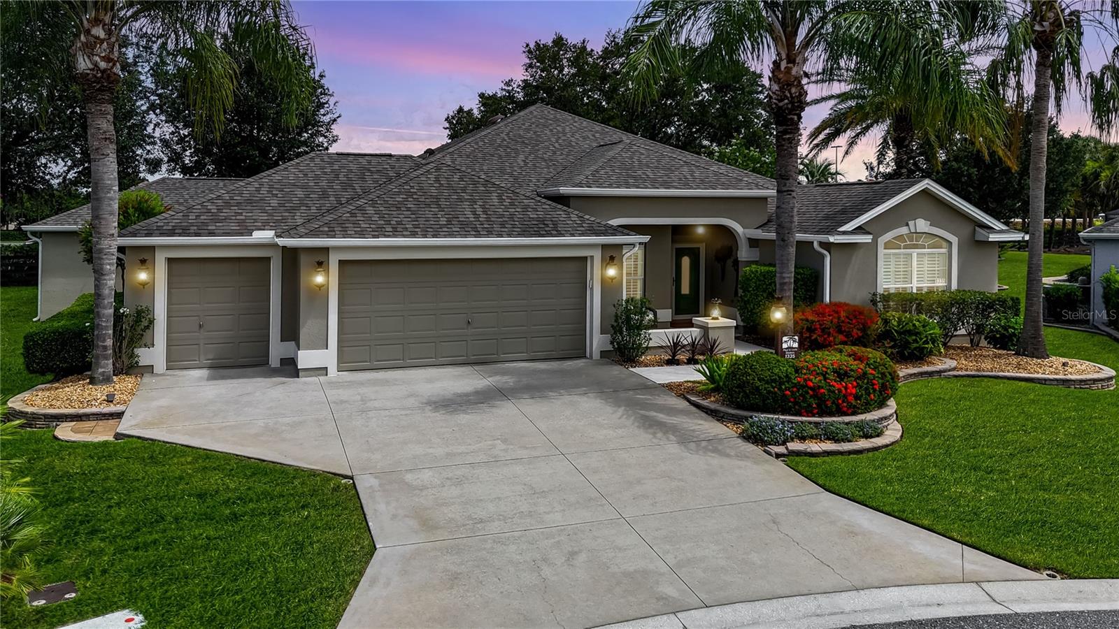 Huge discount by a motivated seller. This beautiful Gardenia was custom built by the current owner and has been stretched in many areas. Located at the end of a cul de sac in the Village off Bonita. As you drive up to this home, you will notice the golf cart garage (stretched 2 feet) and a lovely added concrete front porch with a privacy wall. As you enter the home through the Larson full glass storm door, you are greeted by gleaming diagonal tile in the living, dining, kitchen and baths. There is engineered hardwood in all the bedrooms and diagonal tile on the enclosed, stretched lanai. The lanai has no homes behind and a view of the Kenya golf course to the side. The four sliders from the living room extend into the wall and have been reconditioned to move easily. An extra room has been added to the back of the home (18x20). The living room, two guest bedrooms and guest bath have all been expanded 2' to the right and the front bedroom has also been extended 3' to the front. The Primary bedroom has 3 walk-in closets. There was an extra closet built off the walk-in closet on the right and gives the owner wonderful additional storage. There are dual sinks with granite counters in the Primary and a gorgeous tiled Roman walk-in shower. There is a solar tube in the bath area. The Primary bedroom has a tray ceiling and is large enough for a king sized bed and more. This home has Norman plantation shutters, crown molding ( in the living room some of the crown molding has indirect lighting). The walls all have rounded corners and the baseboards are 51/2 ". The kitchen has stainless electric appliances ( gas is available), pullouts in cabinets and the pantry and granite counter tops. There is a nice nook area, perfect for a table and chairs and the bar area is great for bar stools or a buffett for company. The chandeliers in the nook and the dining room are by Hinkley. Other extras in this home include custom mirrors above the sinks in the Primary bath, a safe that is bolted to the floor in the Primary, whole house water filtration and a new disposal in the kitchen (2024). All of the balancers in the windows have been replaced, the plastic pull water supply lines were replaced with braided steel and extra insulation was blown in the attic, over the house and lanai.. HVAC 2023, Roof 2022, Hot water tank 2020, whole house vacuum system, and a surge protector. Don't miss the beautiful pineapple custom lighting on the front of the home and the porch. BOND IS PAID