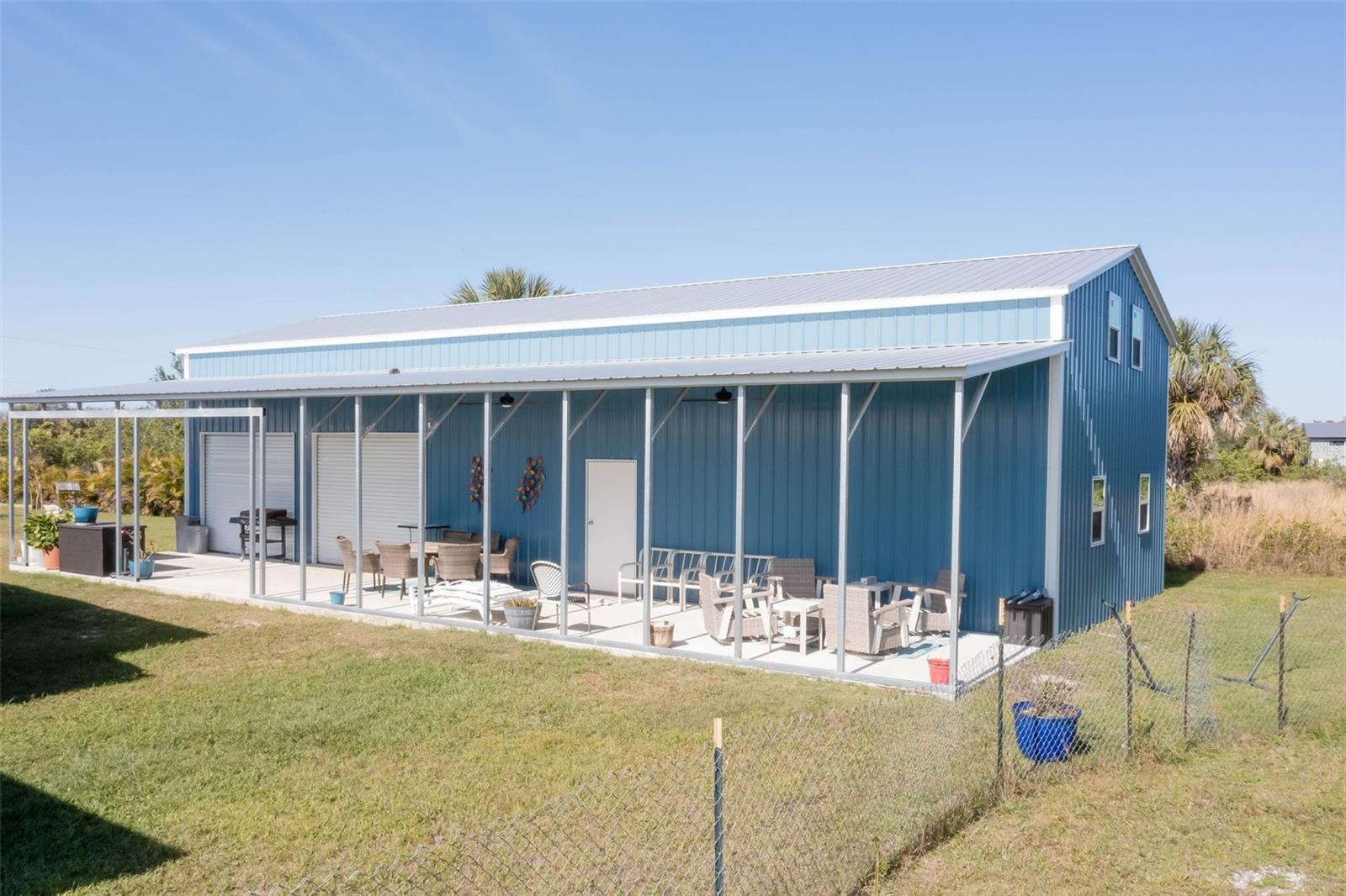 2.5 fenced acres with a huge steel building and two living cabins in the Charlotte Ranchettes! With AG zoning, utilities and buildings in place you can make this property anything you want. Utilites are already on property with a 300+ ft well, a top of the line water softener/treatment system, and electrical service connected. Other improvements consist of a 24 x 60 steel building with a 12 ft wide lean-to (making the total building 2,160 sq ft under roof), a 12 x 40 shed, a 12x24 shed, and a 40 ft container for storage (all of which are spray foamed for for exceptional cooling efficiency). Come explore the allure of the Charlotte Ranchettes, a dirt road community great for riding atvs, utvs, and horses over 2400 acres. Some of country living at its best and yet conveniently positioned close to downtown Punta Gorda, grocery stores, public boat ramps, Cecil Webb Preserve with over 66,000 acres of hunting, and I75 exits for easy travel. Don't miss this oppurtunity with all of the hard work and heavy expense of developing raw land.