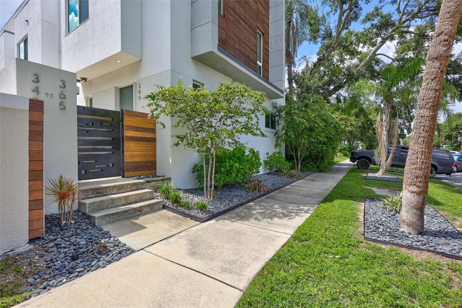 Experience the vibrant lifestyle of downtown St. Petersburg in this beautifully furnished, organic modern townhome. Located just steps away from the dining, entertainment, and excitement of Central Avenue, this residence is situated in a high and dry, non-flood zone.
This exquisite 2-bedroom, 2.5-bath townhome comes fully furnished with brand-new bedding, bath linens, kitchen essentials, and more. Simply bring your clothes and a toothbrush! Designed by the renowned designers of Armature Works in Tampa, this home offers functional and convenient living.
The main level features an open-concept living space that opens onto a private patio. The third-level master bedroom boasts an ensuite bathroom with a double sink vanity and a spacious walk-in closet. French doors lead to a north-facing roof terrace, providing a shady spot to enjoy views of the downtown skyline.
The guest bedroom, located on the second floor, also includes an ensuite bathroom and a large walk-in closet. Adjacent to the guest bedroom is additional living space, currently set up as a home office. The flexible design of the second and third levels allows for a variety of living arrangements.
This unit includes a designated covered parking space and ample street parking. Conveniently located near all the restaurants, nightlife, entertainment, and shopping of downtown St. Pete, it also provides easy access to Baycare/Orlando Health Hospital and is just a 15-minute drive to St. Pete Beach.
Welcome home and enjoy the convenient comfort of downtown living.
