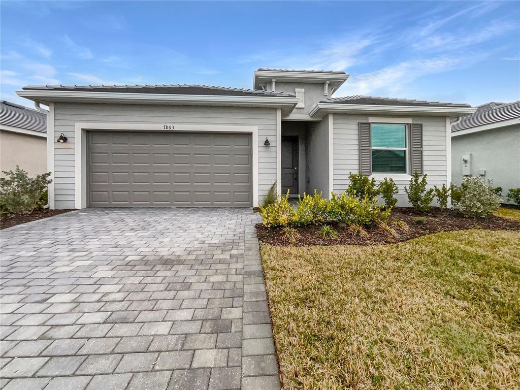 Photo of 7863 Lakes Edge Lane, Port Charlotte, FL 33981 (MLS # O6382630)