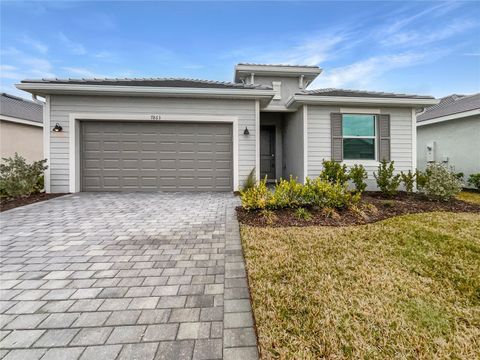 Photo of 7863 Lakes Edge Lane, Port Charlotte, FL 33981 (MLS # O6382630)