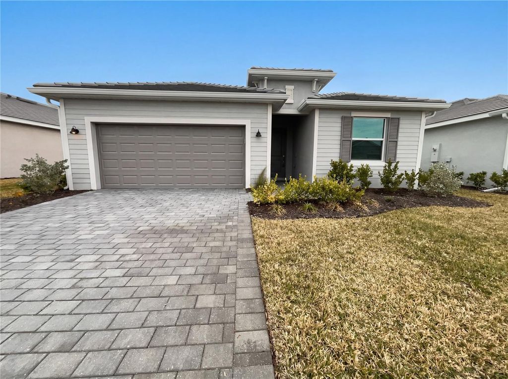 Photo of 7863 Lakes Edge Lane, Port Charlotte, FL 33981 (MLS # O6382630)