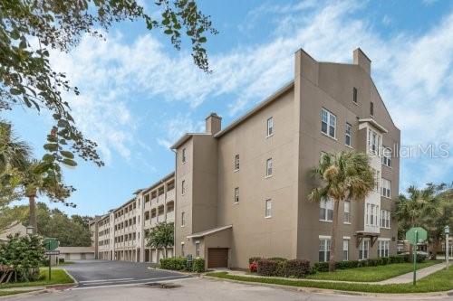 Furnished, Beautiful, Top Floor 2 Bedroom, 2 Bathroom Artisan Condo. This condo has been updated with durable, non-slip driftwood porcelain tile floors, lovely lighting and fans, crown molding, newly remodeled, updated bathrooms with beautiful colors, wood shutters throughout, top of the line appliances including large capacity Maytag washer and dryer. The kitchen features 42" raised panel maple cabinets, a built-in desk, newer dark grey stainless appliances, a farmhouse sink with a pullout spray faucet, and a cozy breakfast nook area. The split bedrooms provide privacy and the primary bedroom has a spacious closet with custom built-ins. The primary bathroom has a new walk-in shower with a large rain showerhead. There is a spacious balcony to start and end your day. The condo comes with a storage cage that is a short walk from the condo. The Artisan Park Clubhouse has a restaurant, bar, fitness area, showers, hot tub, grilling area, banquet room and a resort-style pool. Downtown Celebration is a short drive which has restaurants, shopping, tennis, post office, walking trails, a charming hotel and great events throughout the year. FULLY FURNISHED, GARAGE DOES NOT CONVEY