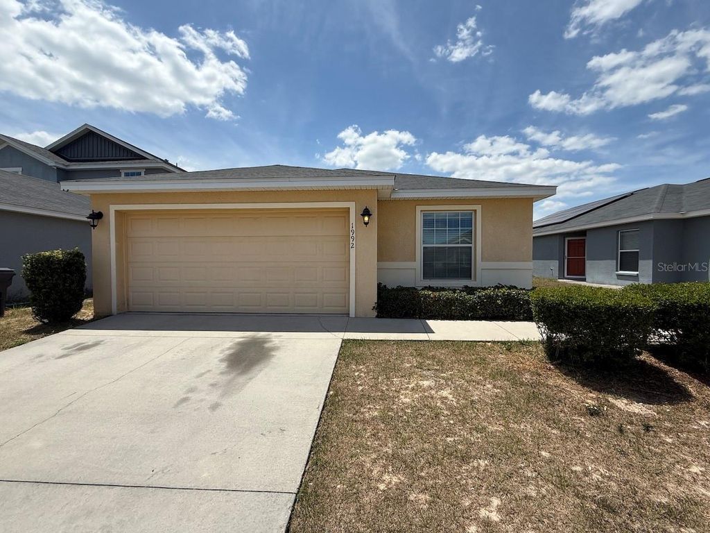 Photo of 1992 Bretton Ridge Way, Winter Haven, FL 33884 (MLS # O6376802)
