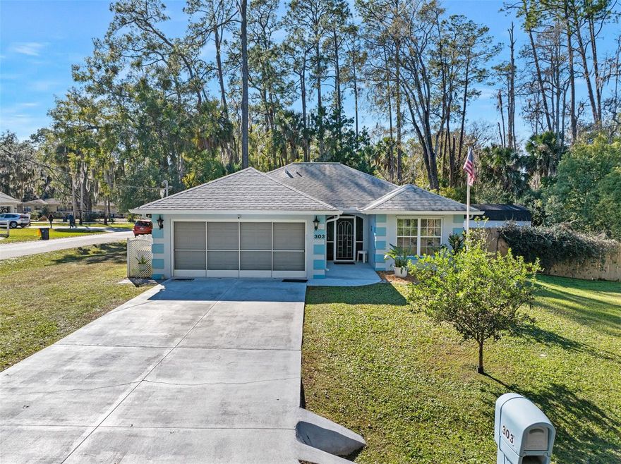 Welcome to 303 N Anderson St, a turnkey, move-in ready 3-bedroom, 2-bath home located in the heart of Bunnell, Florida. This corner-lot property sits on a rare double lot totaling approximately 0.24 acres, with undeveloped wooded areas both in front of and behind the home, offering added privacy and a peaceful setting. The home features a functional split floor plan with 1,644 square feet, a glass Florida room, and bright, open living and dining areas filled with natural light. The kitchen offers ample counter space and storage for everyday living. Ceiling fans are installed in every room, adding comfort throughout the home. The primary suite includes a private bath and generous closet space. Two additional bedrooms provide flexibility for family, guests, or a home office. Recent improvements include a new roof and an updated outdoor living area featuring a large rear patio with steps down to a cozy fire pit, perfect for roasting marshmallows or relaxing by the fire.

The fully fenced yard adds privacy and functionality.

A very large detached shed offers excellent versatility and can easily serve as a workshop, man cave, or she-shed. With no HOA, this property allows the freedom to park RVs, boats, trailers, and other recreational vehicles.

A mature Barbados cherry tree in the front yard produces an abundant seasonal harvest, complemented by fragrant jasmine that fills the air when in bloom, adding charm and a peaceful outdoor atmosphere.

Conveniently located just 8.5 miles from Flagler Beach and adjacent to the Grand Reserve Golf Club, this home offers an ideal balance of privacy and proximity to coastal or country living. Close to schools, shopping, dining, and major roadways.

Please call for showing.