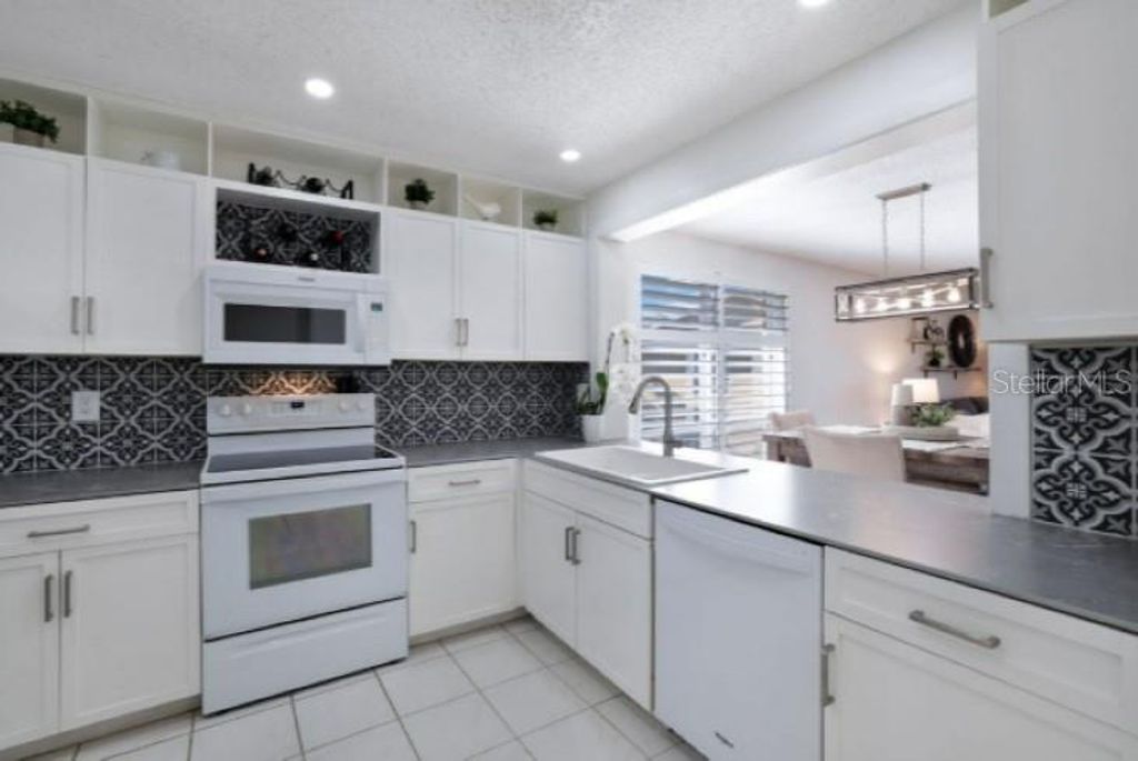 Photo of 1250 Yesica Ann Circle #E201, Naples, FL 34110 (MLS # A4667385)