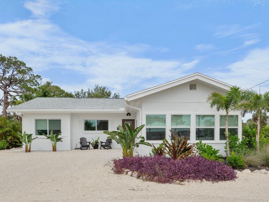 Discover the essence of relaxed Gulf Coast living in this charming beach house. Just bring your suitcase and immerse yourself in the lifestyle, with Nokomis Beach and Pop's Sunset Grill within easy walking or biking distance. NOT IN A FLOOD ZONE. No Flood Insurance Required. No Storm damage.

This delightful home has been beautifully renovated and features:
 **A stunning new kitchen:** Boasting all-new appliances, cabinets, a custom hood, quartz countertops, recessed lighting and fixtures, a tiled backsplash, and updated plumbing and electrical systems.
* **A refreshed bathroom:** Complete with a new vanity, fixtures, toilet, recessed lighting, and fan.
* **A serene master bedroom:** Enhanced with shiplap over concrete walls.
* **Convenient new amenities:** Including a new washer and dryer.
* **Enhanced security and efficiency:** Featuring new hurricane-rated doors and 17 new hurricane-rated windows.
* **Stylish new flooring:** With luxury vinyl installed in 2025.
* **A remodeled outdoor beach bath and outdoor shower:** Perfect for rinsing off after a day at the shore.
* **Updated outdoor spaces:** Including new landscaping, updated sprinklers, an extended driveway with new rock, and an exterior painted in 2024. The roof was updated in 2019.
* **Modern electrical system:** With a new electrical panel installed in 2025.
This home is being offered TURNKEY furnished with comfortable and stylish furniture, linens, tableware, and small appliances. Enjoy being just steps from the beach on the mainland, outside of a flood zone. After your beach adventures, take advantage of the convenient beach bath with its large outdoor shower, and unwind on the expansive private patio.
This fantastic property is ideal for personal enjoyment or as a highly desirable beach rental.