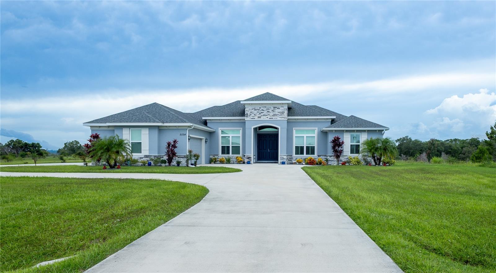 Lake Toscana is a 512-acre gated community with just 127 homes, each having .5 to 1 acre lots of open land, peace, and privacy. It is not unusual to see deer and other wildlife frolicking about this private community which has walking trails, a pavilion, a playground, access to the Little Manatee River. This Cortona model home built in 2020, offers luxury and a desirable one-acre privacy lot with no neighboring homes behind or on either side of the property. The open-concept layout flows seamlessly to the backyard, where the patio opens to a gorgeous pool surrounded by a privacy fence, creating the perfect retreat for relaxation or entertainment. Combining thoughtful design with premium upgrades, this home is a true standout.