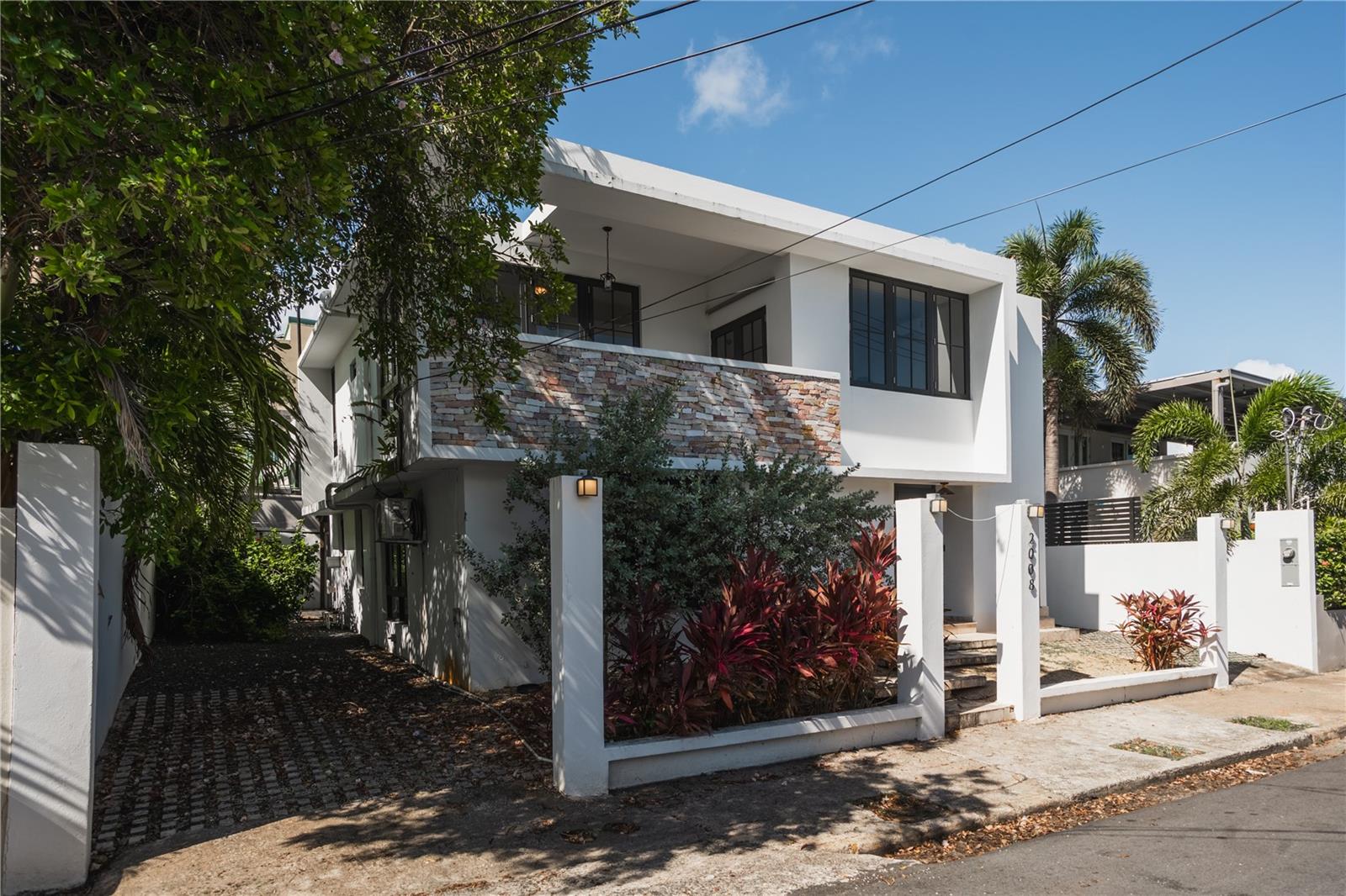 Exceptional investment opportunity in one of San Juan’s most desirable beachside communities. This beautifully renovated and furnished two-story home on Cacique Street, inside the gated community of Ocean Park, offers versatility, comfort, and a prime location.
The property features 5 bedrooms, 4 bathrooms, and is currently operating as a successful income-producing short-term rental.
Designed with flexibility in mind, the home can function as a spacious single-family residence or be divided into two separate units, each with private entrances and its own kitchen. The layout includes 3 bedrooms on the first floor and 2 bedrooms upstairs, with a connecting interior door that allows for easy conversion between one large home or two independent units.
Additional amenities include a full backup generator, water cistern, and off-street parking. The home is also located in a flood-free zone and offers the potential to add a pool, allowing you to create your own private oasis.
Situated just steps from the beach, within walking distance to some of Puerto Rico’s top private schools, and only 10 minutes from the airport and Old San Juan, this is a rare opportunity to own a high-value property in Ocean Park.
Whether you’re searching for a primary residence, vacation home, or a high-potential investment, this flexible property in Ocean Park is a rare find.