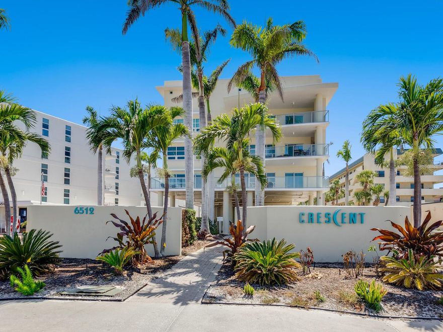 Welcome to luxurious, maintenance-free beachfront living at prestigious Crescent Siesta Key Condominiums. This 1,800-square-foot turnkey-furnished unit offers three bedrooms, two full baths, a laundry room and two large balconies, one with beach views, and the other overlooking the second-level Crescent pool/courtyard. The inviting open floor plan includes a large dining room. The kitchen is open to the dining room and living room. Poggenpohl (luxury German-made) cabinets, stainless appliances, large breakfast bar and spacious pantry/storage cabinets line the hallway. It is near south Siesta Key Bridge with shopping, entertainment and dining across the street. The Crescent is a boutique complex of only 26 units and offers direct beach access, a gulf-view pool with whirlpool hot tub, as well as a single-lane lap pool, a gourmet poolside summer kitchen and a beautifully landscaped garden terrace with poolside seating. It includes well-appointed common areas, elevators to all floors, a clubhouse, a fitness room, reserved two-car covered parking, a car charging station, on-site manager and 24-hour video surveillance with common areas secured by keypad access. It is a pet-friendly community for owners only. Investors alert! The unit is on the vacation rental program with Beachside Management, and it attracts lots of bookings. This is must-see.