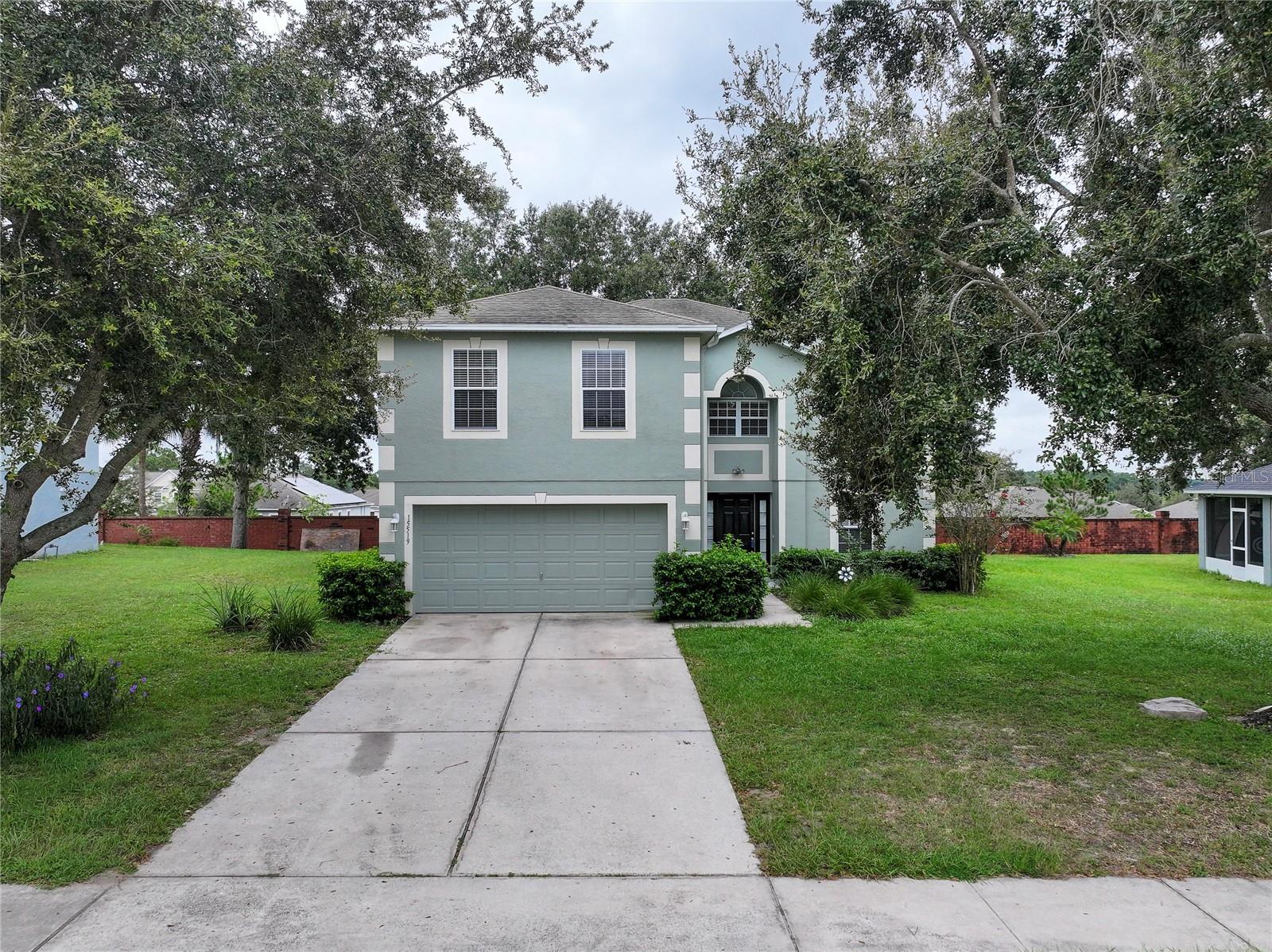 Welcome to Shearwater Estates, a gated community in Mascotte, Florida. This spacious 4-bedroom, 2.5-bath home offers a versatile layout with plenty of living space. The formal dining room is ideal for entertaining, while the separate living room provides a comfortable place to relax. Upstairs, you’ll find four generously sized bedrooms, including a primary suite with dual sinks, walk-in closets, and an en suite bath. An oversized loft adds even more flexibility, perfect as a second family room or office. The kitchen features an island with Corian countertops, ample storage, and room for a dining table to enjoy casual meals. Enjoy a private backyard with no rear neighbors, offering peace and privacy. Don’t miss this opportunity—schedule your showing today!