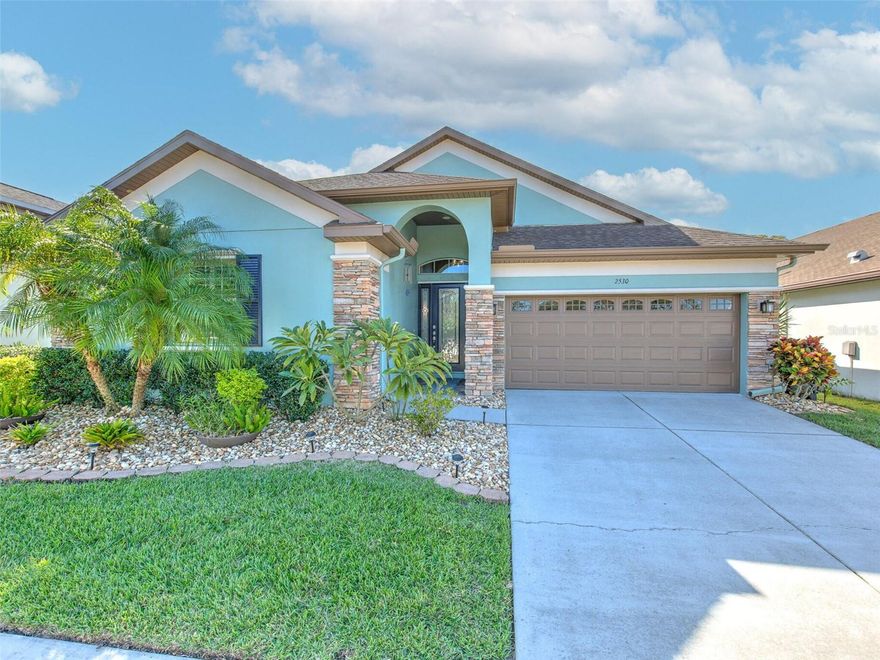 THE PERFECT 3 BR HOME DOES EXIST!  And here it is!  A 3 BR, 2 bath, 2,010 sq ft gem tucked away down a side street you've probably never noticed but that is just a jaunt to the Countryside Mall.  Deeb Family Homes built a beauty back in 2013 but you'd think it's brand new!  Mr. & Mrs. Clean live here, so you won't need to do anything except move in. : )  Arrive to meticulously maintained grounds that are VIRTUALLY MAINTENANCE-FREE, and prepare to be wowed by STACKED STONE, modern and happy, new exterior paint, a carriage-style garage door, and beautiful leaded glass front door and sidelight windows.  Come inside this stunning, OPEN FLOOR PLAN with VAULTED CEILINGS where GORGEOUS 5" HARDWOOD FLOORS flow through the SPACIOUS DINING & LIVING ROOMS.  And it gets even better as you reach the fabulous kitchen with its custom raised panel cabinets, GRANITE COUNTERS with breakfast bar, STAINLESS STEEL APPLIANCES featuring a gas stove, and tumbled stone backsplash.  You'll also notice the UPGRADED LIGHT FIXTURES, ceiling fans, and PLANTATION SHUTTERS THROUGHOUT.  There is LIGHT 'N BRIGHT living thanks to the TRIPLE SLIDING GLASS DOORS and arched transom window leading to your INVITING AND PRIVATE PATIO.  The COVERED & SCREENED OUTDOOR SPACE with vaulted ceilings and brick pavers can be perfect for entertaining, or a peaceful retreat; the vinyl privacy fence, lush robellini palms, and translucent screens complete this tranquil spot.  An enormous owner's suite with rich porcelain tile floors, TRAY CEILING, plantation shutters, and patio access validate you on your forever home!  2 generous WALK-IN CLOSETS keep bickering at a minimum.  The EN SUITE MASTER BATHROOM boasts DUAL GRANITE VANITY, garden tub, step-in shower, linen closet, and private water room.  The SPLIT FLOOR PLAN features ample secondary bedrooms at the front and middle of the home; the front bedroom is currently used as a den and includes a walk-in closet, middle bedroom has a vaulted ceiling (both are tile floors, no carpet here!).  Interior laundry room includes washer & dryer.  Now to the garage... gleaming EPOXY FLOORING, attic with pull-down stairs, INSULATED GARAGE DOOR with impact windows, Linear garage door opener, gas water heater, and WATER SOFTENING SYSTEM may very well make this your favorite room in the house!  So many extras, too, like HURRICANE SHUTTERS, HVAC with UV light and 4 inch filter, reclaimed water, landscaping lighting, water-saver toilets, new garage door spring, the list goes on!  Only 10 homes in the community of Countryside Cove and lawn mowing / grounds maintenance, hedge trimming, irrigation, and trash / recycling ALL INCLUDED for an AFFORDABLE $185 PER MONTH!  Centrally located in Pinellas County, and high 'n dry NOT IN FLOOD ZONE, it's a convenient drive to shopping & dining, amazing area beaches, Downtown St Pete, multiple airports, great golfing, the Pinellas Trail, etc.  That's why PERFECTION is not too strong of a word here!  Floor plan and 360 degree tour included in the listing.  But feel free to schedule your tour so you can see the perfection in person!