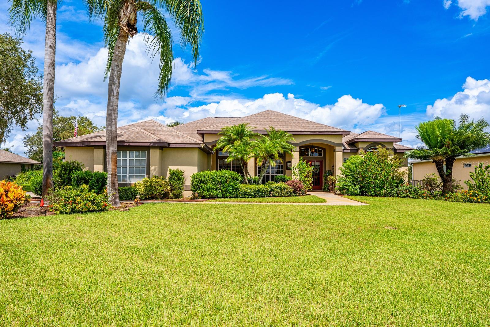 Ask about a lender provided RATE BUY-DOWN CREDIT on this home! ****Welcome to Glen Abbey Estates where your new custom single story POOL HOME sits on just under HALF AN ACRE with sweeping GOLF COURSE & WATER VIEWS! Designed for both comfort and style, this home has been consistently maintained and upgraded to give you confidence and peace of mind from the moment you move in. Stepping inside you will find a thoughtfully designed SPLIT BEDROOM FLOOR PLAN with formal living and dining rooms, a spacious family room finished with a cozy FIREPLACE, and a casual breakfast nook overlooking the pool. Your generous PRIMARY SUITE offers a large WALK-IN CLOSET, extended sitting area, direct access to the lanai/pool and a beautifully appointed en-suite bath, while the remaining bedrooms and a second full bath are set apart for privacy. The modern kitchen is the true heart of the home, with crown molding topped cabinetry, desirable STAINLESS STEEL APPLIANCES, and stylish finishes that flow seamlessly into the main living areas. ****UPDATES/UPGRADES to this home include: - 2025 - NEW DISHWASHER, - 2024 - WASHING MACHINE DRAIN SYSTEM REPLACEMENT, IRRIGATION WELL AIR TANK REPLACED, - 2023 - POOL SCREENS REPLACED, POOL CAGE REINFORCED w/ HURRICANE STRAPPING, GARAGE DOORS INSULATED, DRYER VENTS CLEANED, IRRIGATION WELL SERVICED, - 2022 - NEW HYBRID WATER HEATER, INTERIOR & EXTERIOR PAINT, IRRIGATION SYSTEM, UPDATED INTERIOR & EXTERIOR LIGHTING, a FRONT LANDSCAPE RESFRESH, A/C VENTS REPLACED & VENT LINES CLEANED, NEW POOL PUMP, and replaced MAIN ELECTRICAL PANEL & BREAKERS OUTSIDE.**** The roof is also being replaced prior to closing, giving the next owners the benefit of a BRAND NEW ROOF. Additional features include NASA ATTIC INSULATION, hurricane shutters, and a security system that allows music to be played throughout the home. The outdoor living space is truly an oasis – the expansive COVERED LANAI overlooks the sparkling pool and spa, designed with a diving depth of ten feet, all within a screen enclosure and complete with an OUTDOOR KITCHEN for year-round entertaining. Beyond the screened area, a FULLY FENCED YARD, additional DECK, and outdoor shed provide even more functionality. This elevated lot is considered one of the premier locations in Glen Abbey, offering peaceful surroundings and commanding views. With easy access to I-4 and 17-92, as well as nearby trails, bike paths, and opportunities for paddle boarding, the lifestyle here is both active and convenient. Downtown Deland, Sanford, and Lake Mary are just minutes away for endless shopping, dining, and entertainment. Custom-built, thoughtfully maintained, and upgraded with all the right improvements, this home is MOVE-IN READY and waiting for its next chapter. Your HOME SWEET HOME awaits—schedule your private tour today!