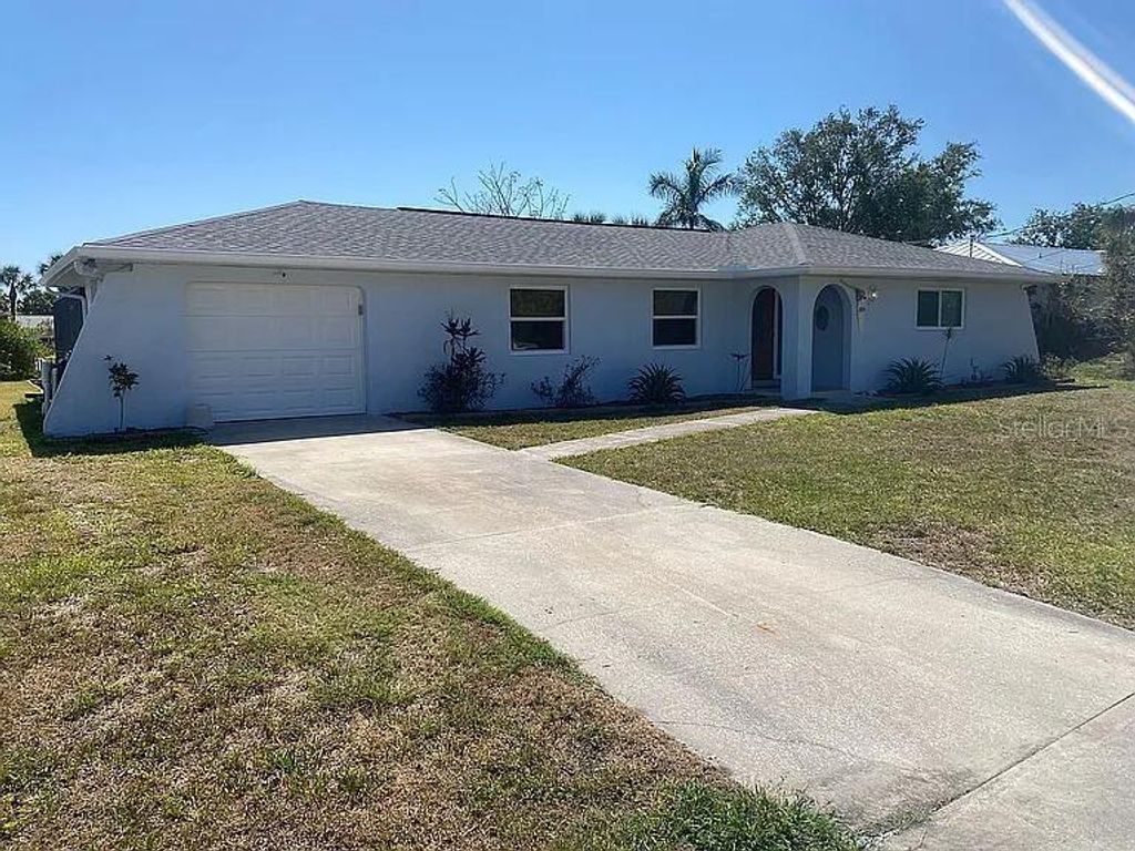 Photo of 18414 Burkholder Circle, Port Charlotte, FL 33948 (MLS # O6400418)