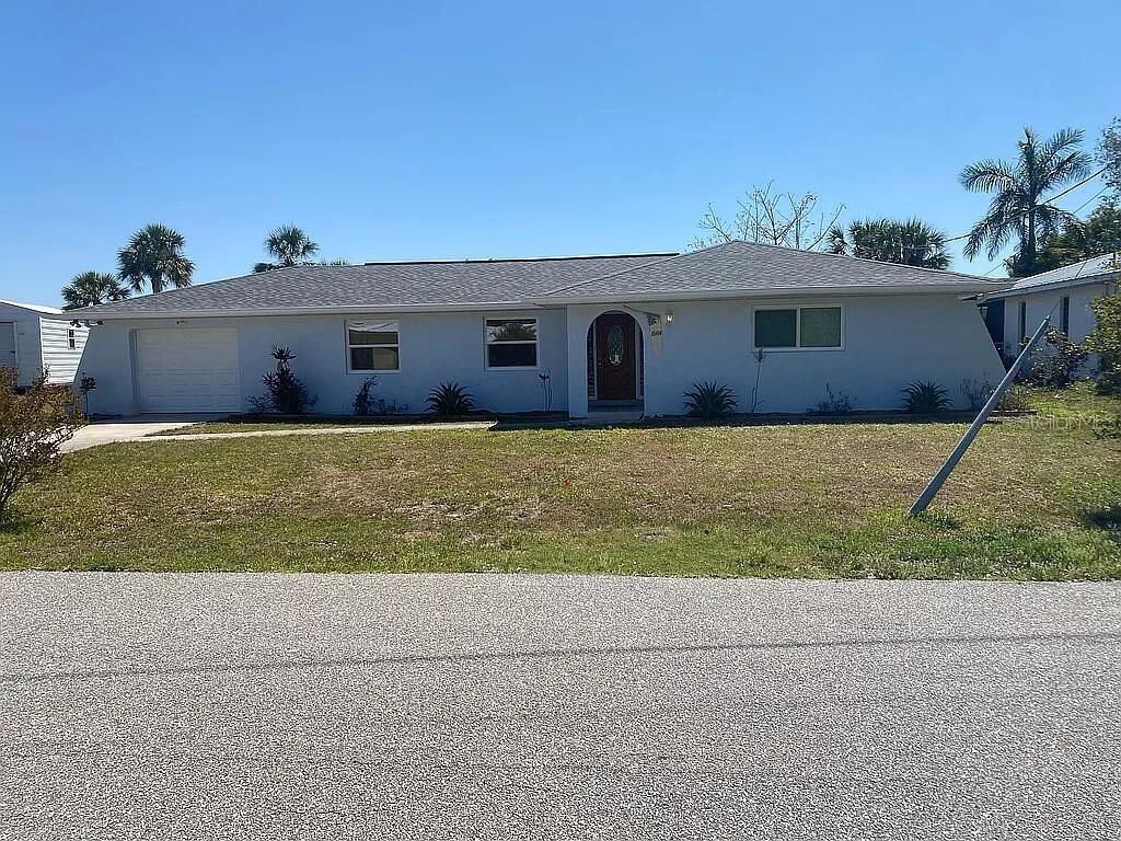 Photo of 18414 Burkholder Circle, Port Charlotte, FL 33948 (MLS # O6400418)