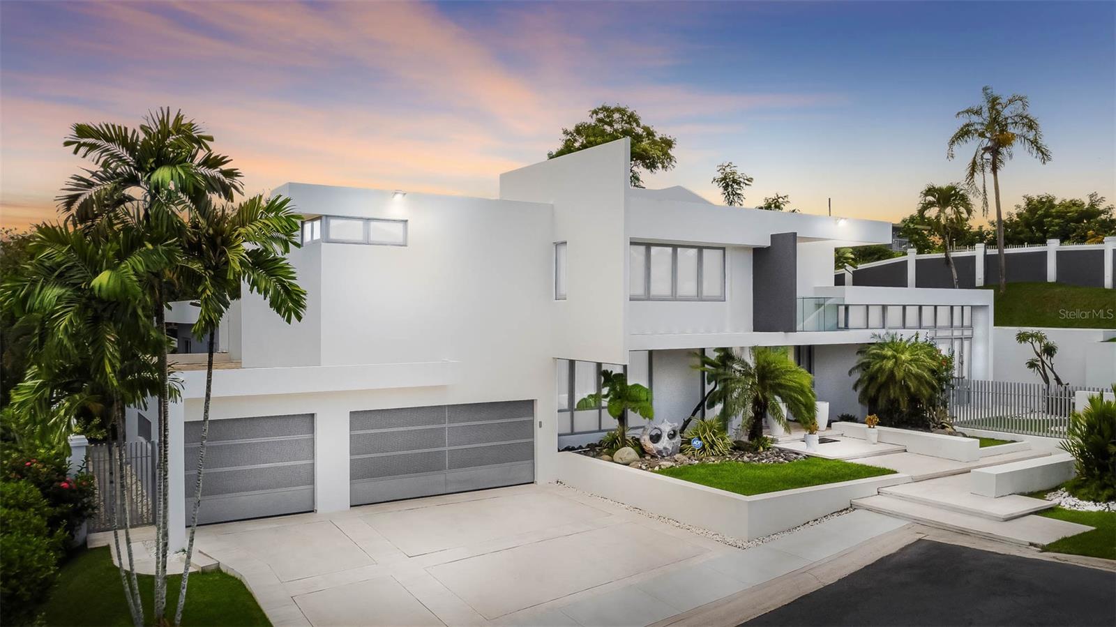 Custom Modern Masterpiece in Baldwin Park Corner Cul de Sac Location
Experience the pinnacle of luxury living in this fully reimagined custom-designed residence nestled on a 1337 square meter corner lot in the exclusive Baldwin Park community of Guaynabo. Perfectly located at the end of a quiet cul de sac and within walk distance to Baldwin School this property offers a rare combination of privacy convenience and exceptional design.
Every detail of this home has been thoughtfully crafted with the highest quality finishes. Custom woodwork adds warmth and elegance to every room creating a cohesive and refined atmosphere throughout. The entire home operates as a fully intelligent system powered by Lutron with lighting shades and features all seamlessly controlled through an integrated iPad system.
Enjoy uninterrupted comfort with a brand new full-capacity generator designed to power the entire home for up to one month. A dedicated control and security room adds peace of mind with advanced home management capabilities. The home is also equipped with a complete water purification system providing clean high-quality water throughout.
With spacious indoor and outdoor living areas this home is perfect for both relaxing in style and entertaining in comfort. From its prime location and thoughtful design to its unmatched technology and security features this residence truly sets a new standard for modern luxury in Guaynabo.
Schedule your private showing today and discover what makes this Baldwin Park home one of a kind.