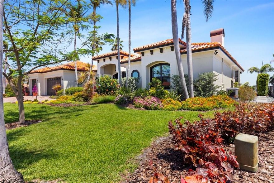 NO FLOODING WITH A 10 FT ELEVATION AND A $500K PRICE DROP.  OVER $1,000,000 IN UPGRADES AND REMODEL.  Discover this one of a kind, highly desirable and rarely available 3000 sq ft, 3 bedrooms, 3 bath, 3 car garage home sitting on a high and dry 1/3-acre open water lot, with unobstructed views of sparkling Tampa Bay. This completely remodeled, turn-key masterpiece is located in the exclusive community of Venetian Isles! This residence has been upgraded with the finest modern conveniences, blending luxurious design with thoughtful functionality. Perfect for hosting and entertaining, this property is the ultimate haven for comfort and style. Key Features and Recent Upgrades include Hurricane Impact Windows & Sliders throughout the home; Upgraded Electrical Panel Replaced with a robust 400-amp panel; a Briggs & Stratton 26kW Natural Gas Generator, featuring a 10-year warranty and connected to the city's gas line; a Custom Pool Remodel, with a beautifully oversized heated salt water pool, perfect for relaxing or entertaining; Sleek Motorized Blinds Throughout; a Gourmet Kitchen, featuring custom wood cabinets with soft-close drawers, a wine-refrigerator, Granite countertops, and upgraded Bosch appliances; Luxury wood laminate Flooring throughout; a Marble wood burning Fireplace, adding touches of timeless sophistication; Extensive Bathroom Renovations to All three bathrooms, featuring high-end finishes, glass enclosures, beautiful granite counters, including smart bidet toilets; Primary Bedroom California Style Walk-In Closet; Retractable lanai screens; Fresh Paint inside and out, giving it a crisp, updated look; Upgraded Lighting with energy efficient LED; Security system includes window and door sensors and outdoor cameras for added peace of mind; a new hot water tank, water softener, and water filtration systems, as well as new fans throughout the home; and a massive commercial grade wood composite dock with a 13,000 lb. boat lift and electric and water connections to keep your boat high and dry and in tip top shape. Attention to detail and pride of ownership is evident throughout. No detail has been overlooked, from the high-end finishes to state-of-the-art safety features. Whether you're an art enthusiast, with plenty of walls, nooks and crannies for your masterpieces; enjoying the stunning custom pool; hosting friends in the open-concept living areas; or taking your boat out for a trip to downtown St. Pete, every corner of this property is designed with your life-style in mind. Located just minutes from thriving DOWNTOWN ST. PETERSBURG, with its large assortment of shops, galleries, museums, and its vibrant nightlife, destinations include the world-famous Dali Museum, University of South Florida, RAYS Tropicana Field, the St. Pete Yacht Club, and the new pier. Homes on oversized open water lots do not come on the market often and will not last long, so don't delay in scheduling your showing today!!!!!