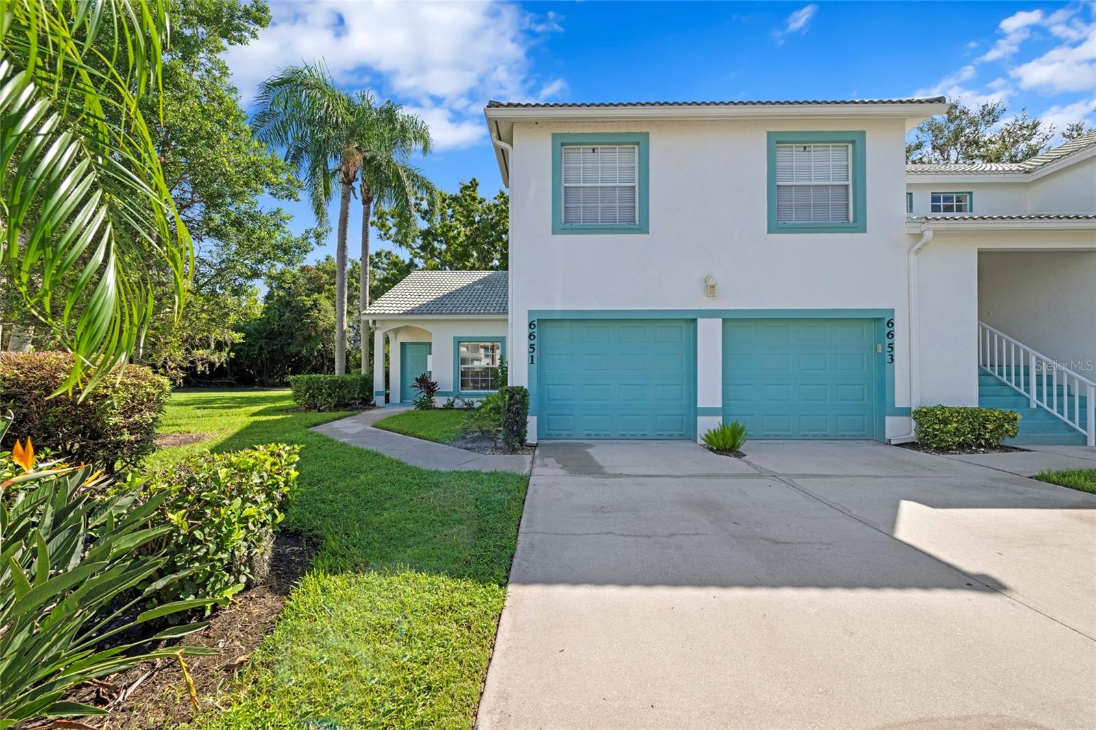 One or more photo(s) has been virtually staged. This charming condo in Fairway Gardens at Tara truly feels like a slice of Florida paradise. It isn’t just a home; it’s a lifestyle waiting to be embraced. As you step inside, you’ll be greeted by an open floor plan that enhances the spaciousness of the living and dining areas, which feature a vaulted ceiling. This area flows seamlessly to a large lanai through wall-to-wall sliders that bring the outdoors in. The lanai stretches nearly the entire length of the condo, allowing for great natural light. Back inside, the spacious kitchen boasts quartz countertops and plenty of cabinet space. Across from the kitchen, the comfortable guest room features a window that opens onto the lanai. Down the hall, you’ll find the guest bathroom equipped with a tub and tile surround. There’s also a conveniently located laundry closet in the hallway. Finally, retreat to the primary bedroom, which includes a large ensuite bathroom and a generous walk-in closet. The bathroom features a double sink vanity and ample space, along with a fully accessible design. Updates include: Kitchen Renovation (7/25), New A/C (2023), New Hot Water Heater (2023), Remodeled Primary Bathroom Shower making it Handicap Accessible. Don’t miss this opportunity to make this extraordinary condo your home and relish the stunning Florida lifestyle—perfectly situated close to everything from the vibrant shops at UTC to the picturesque beaches of Anna Maria Island! Your dream life awaits!