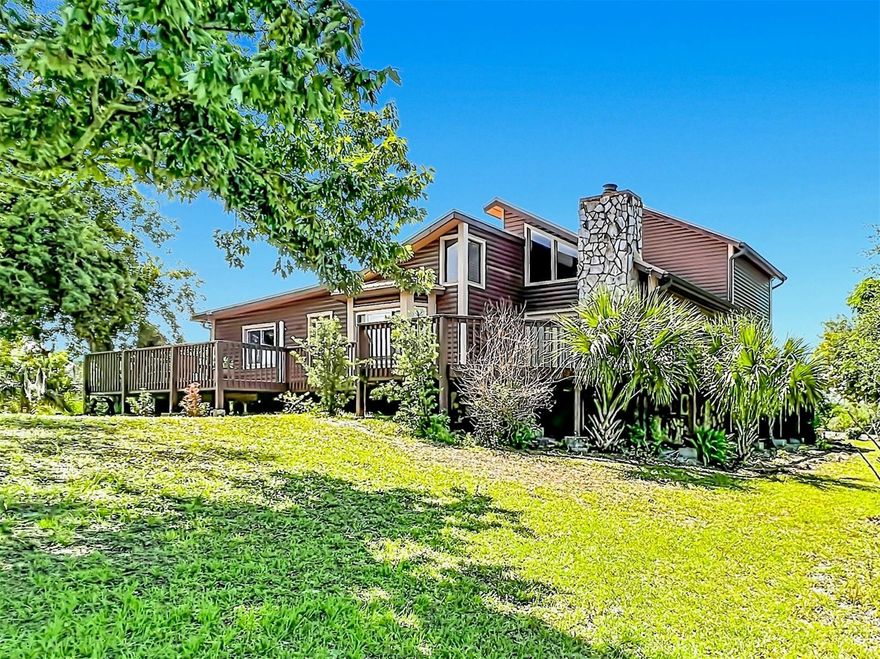 Ascend the winding driveway to one of the highest elevations in Brevard County, where a custom log cabin sanctuary awaits on 1.5 acres. This 3BR - 2 BATH POOL home perfectly captures the rugged, soulful essence of a mountain retreat while remaining just minutes from the beaches and blue waves of the Atlantic and the historic charm of Downtown Titusville.

Inside, the home unfolds with over 2,000 square feet of cozy living space highlighted by towering wood ceilings, plenty of windows to provide natural light and a magnificent stone wall featuring a wood-burning fireplace. The heart of the home is a seamless blend of a spacious family room and a gourmet kitchen equipped with new granite counters & backsplash, wood cabinetry, stainless appliances, gas range & oven and a barn door pantry, all flowing naturally toward the dining area with an elegant bay window.

The entire upper level is dedicated to a private Master Suite designed for total relaxation, boasting a generous walk-in closet and a spa-inspired bathroom with granite vanities, a jetted garden tub, and a separate walk-in shower. Downstairs, two spacious guest bedrooms share a beautifully renovated bath, ensuring comfort for family or visitors. 

Unbeatable Views & Outdoor Living! The experience begins the moment you step outside. You can enjoy rocket launches from your front porch—a front row view of launches that turns every liftoff into a private event.  Beyond the front steps, the lifestyle extends outdoors to an expansive wrap-around wood deck and screened lanai overlooking a sparkling heated pool and spa. Whether you’re hosting a summer barbecue or enjoying a quiet winter soak, this outdoor oasis is designed for year-round enjoyment.

Embrace the ultimate freedom of a property with no HOA, providing ample space and dedicated carports for your RVs, boats, and trailers. This estate is as practical as it is picturesque, featuring a newer septic system, a metal roof, a tankless water heater, and a transferable termite bond for total peace of mind. 

ADDITIONAL FEATURES INCLUDE:  MANY NEW CAT. 5 RATED WINDOWS - NEW A/C (2024) - NEW IRRIGATION PUMP (2025) - NEW SEPTIC (2021) - NEW POOL PUMP (2022) - HEATED POOL (2017) - METAL ROOF (2016) - Tankless Water Heater - City Water - Irrigation on well (acid treated 3/22) - Chicken coop - Shed(s).

Located close to the Space Coast’s booming tech and aerospace hub, NASA's Kennedy Space Center, local beaches, Merritt Island National Wildlife Refuge, Titusville Marina Park, Hiking & Equestrian Trails & Chain of Lakes Parks, Golfing, Bioluminescence Tours, and the Brevard Zoo.  Easy access to I-95.  One hour drive to four Major Airports and Orlando Theme Parks & Attractions.

Schedule your showing today and don’t miss this rare opportunity to own a piece of Florida that feels worlds away from the everyday—a true mountain-style escape with coastal convenience.