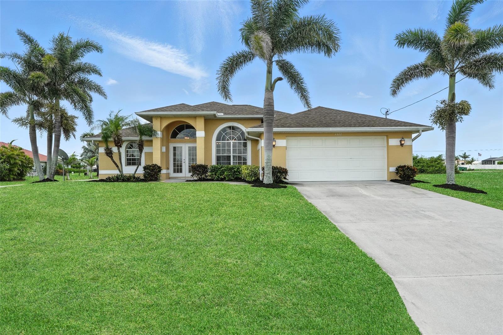 Welcome to 4322 NW 32nd Terrace, a well-maintained, long-term rental property with a successful 10-year history, now ready for its next chapter. Situated on an oversized corner lot in a desirable NW Cape Coral neighborhood, this home offers exceptional space, privacy, and flexibility—with plenty of room to add your dream pool and spa. Elevated 9 feet, this property not only provides peace of mind but also offers the potential to be removed from the flood zone. Additionally, it comes with an assumable flood insurance policy, making it even more appealing for savvy buyers. The open floor plan is bright and inviting, featuring soaring ceilings and tile flooring throughout the main living areas. The spacious kitchen is equipped with stainless steel appliances, ample cabinetry, pantry space, and a convenient peninsula that flows seamlessly into the living and dining areas—perfect for entertaining or everyday living. This thoughtfully designed home includes 3 generous bedrooms, 2 full bathrooms, and a versatile den that can easily function as a home office, playroom, or additional guest space. The interior laundry room comes complete with a washer and dryer, and the home is supported by a brand-new water system installed in 2025. Whether you're looking for a full-time residence, seasonal getaway, or investment property, this home offers solid value, excellent potential, and an ideal location in a fast-growing area of Cape Coral.
