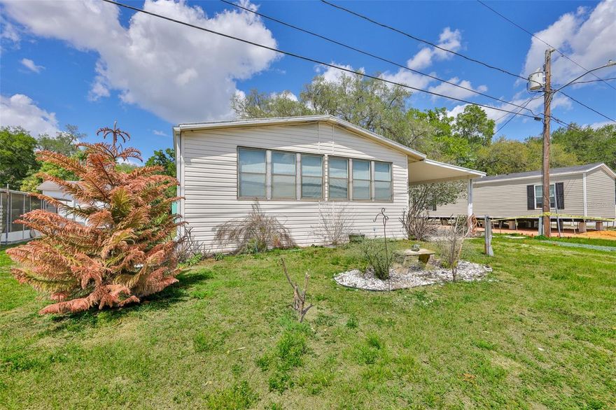 Welcome to this charming 2/2 doublewide manufactured home with a cozy screened porch-perfect for enjoying your morning coffee or evening breeze. Inside, you'll find plenty of space with a family room, living area, dining room, and a generously sized kitchen with lots of cabinets. Two storage sheds offer great space for tools, hobbies, or extra storage. Ideally located close to hospitals, shopping, and dining. Annual fee includes water. Situated in a 55+ community.