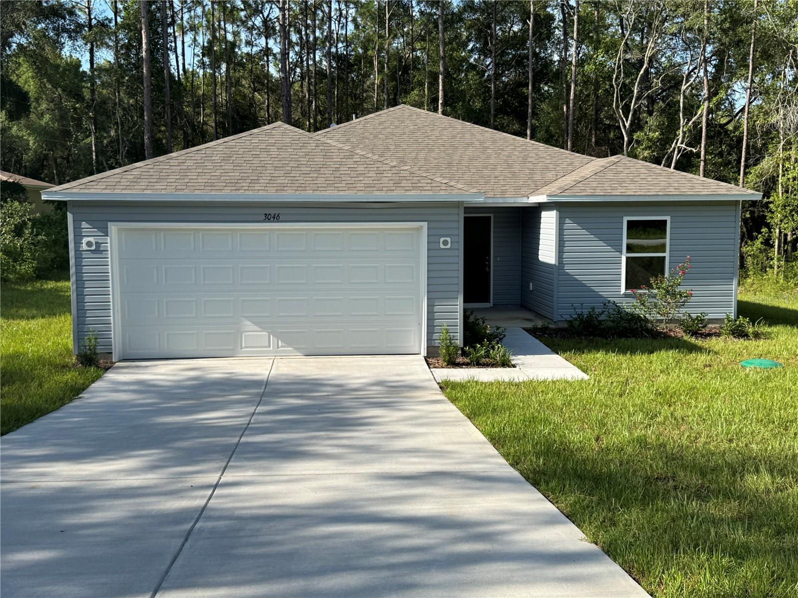This brand-new construction features 3 bedrooms and 2 bathrooms, offering modern design, comfort, and quality throughout. Welcome to this beautifully designed Florida-style home, where comfort and elegance come together in a thoughtfully planned layout.
As you enter, a foyer sets the tone for the stylish interior. Just off the entryway is a versatile flex space—ideal for a home office, playroom, or additional living area tailored to your needs.
The open-concept kitchen is a standout, featuring white quartz countertops, modern gray cabinetry, a spacious island, and a dining area perfect for both everyday meals and entertaining. A generous pantry and included refrigerator add practicality to this well-equipped space. Luxury plank flooring enhances the main living areas, kitchen, bathrooms, and laundry room, combining style with durability. Meanwhile, plush carpeting in the bedrooms provides a warm, inviting retreat.
Outside, enjoy the professionally landscaped yard and extended rear patio—perfect for outdoor dining, relaxing, or hosting in the Florida sunshine. Plus, with no rear neighbors and a peaceful conservation setting, you'll appreciate the added privacy and natural views.
Conveniently located near schools, restaurants, and shopping destinations, this home offers the perfect blend of serenity and accessibility—making it an ideal choice for comfortable Florida living. AVAILABLE NOW. RENTERS INSURANCE REQUIRED