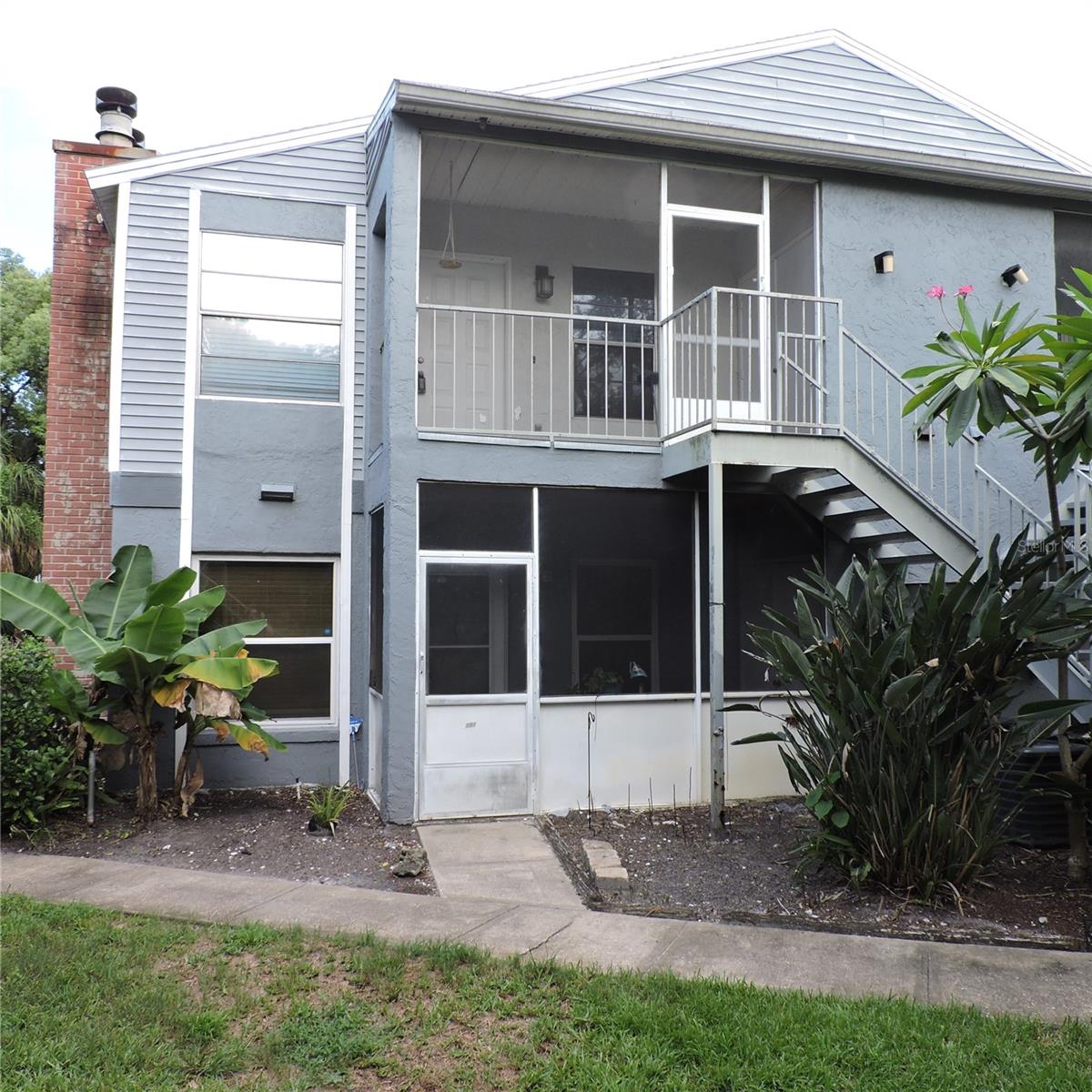 Very nicely renovated 2 bedroom 2 bath second story Condo on a very private location within the community. Well maintained and move in ready! Kitchen has high end cabinetry with dove tail undermount track soft close drawers, corner storage cabinet and granite counter tops. Stainless steel newer appliances. Large Kitchen pantry. Kitchen opens up to combination Dining room/Living Room with high vaulted ceilings, ceiling fan, coat closet and wood burning fireplace! Master Bedroom has full bath with granite toped vanity, ceiling fan and large walk-in closet. Second bedroom has a large reach-in closet and ceiling fan. All rooms have newer continuous laminate flooring. Bathrooms have Ceramic tile floors. Outside front door is a screened in patio and off this is a dedicated laundry closet with washer and dryer included. Additional shelving for storage. AC and water heater are both newer as well. Community is zoned for Lake Mary Schools. Very large and beautiful Community Pool is adjacent to Clubhouse with workout room, gorgeous Lake with a community dock with benches to take in the view. Adjacent to the pool and in this tree covered park like setting is a nicely finished and lighted tennis/Pickleball court and also a lighted racquetball/handball court.
Make your appointment to show today as this gem won't last long!