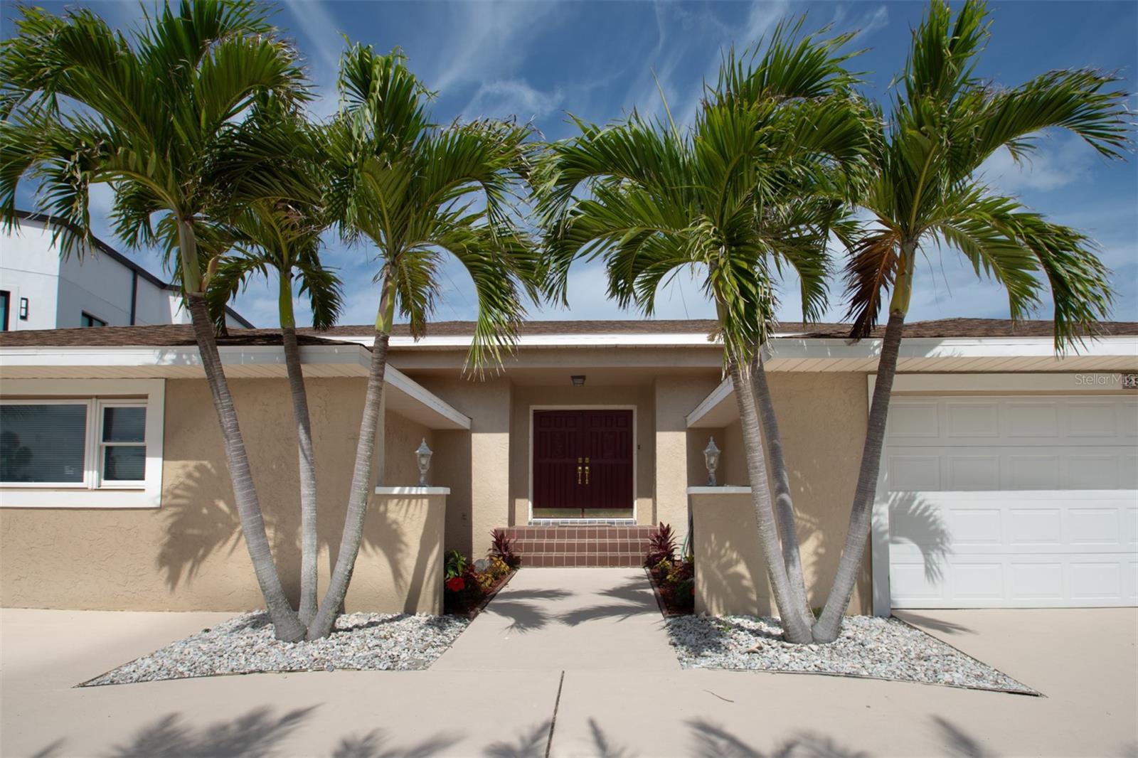 One or more photo(s) has been virtually staged. Just a stones throw from the resident only Belleair Beach! Live like you are on vacation every day in this lovely home located steps from Belleair beach, only accessible by residents. Enter the foyer through double solid wood entry doors and be impressesed by the full size, completely PRIVATE pool in the center of the home. Open the many sliding doors and make the pool area part of your daily living space. Experience a Resort feel with the ultimate privacy. Solidly constructed, this unique home showcases an eat-in kitchen with diagonally laid tile, solid wood cabinetry, granite counters, stone back splashes, stainless steel appliances, breakfast bar and tray ceilings. The family room features valuted ceilings, a stone wood burning fireplace and inlayed tile work. With 5 bedrooms, there is plenty of space to house family and guests. The fifth bedroom can easily be converted to a game room by stowing the built-in murphy bed to provide even more area to entertain and relax. ALL bathrooms have been recently updated. The two car garage and large circular driveway provides plenty of off-street parking. An additional welcoming feature is that this sturdy home is built up to nearly 10 feet above sea level, yet still constructed on a slab. Located close to shopping, fine dining, community boat ramp, community park and tennis courts. INVESTOR ALERT!! Hot area with rapidly growing equity. Can do a minimal remodel & resell at a price well worth your effort! OR move in as is and live in beautiful Belleair Beach! Some images are virtually staged. Home comes partially newly furnished! Lender credit can be used towards closing costs and/or interest rate reduction. This credit is in addition to any concessions negotiated in the transaction.