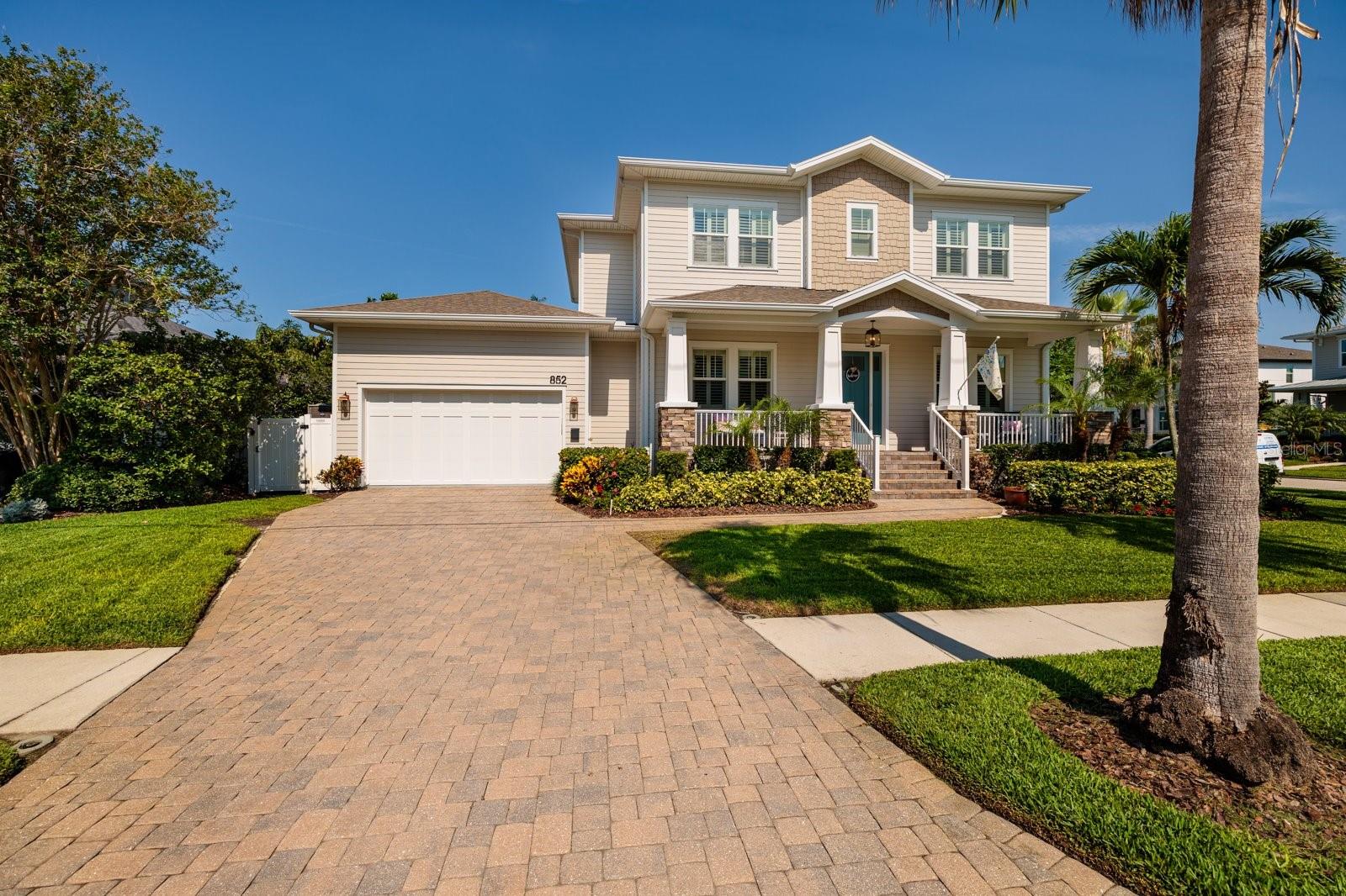Welcome to this stunning Craftsman-style home in the highly sought-after Snell Isle neighborhood. Built in 2015 and situated on a generous corner lot, this elegant 5-bedroom, 4.5-bathroom two-story residence offers over 3,500 square feet of thoughtfully designed living space and is packed with premium upgrades. The current owners have spared no expense, adding a buried 500-gallon propane tank to fuel the high BTU Capital Culinary five-burner gas cooktop, a new custom stainless steel range hood, and a newer custom "Sekas" saltwater pool and spa with a new pump and salt cell. Plantation shutters adorn most of the home, and fresh interior paint has been completed throughout. The open floor plan is ideal for entertaining, boasting a spacious chef’s kitchen with quartz countertops, an oversized wraparound island with farm sink, a walk-in pantry, and a sunny breakfast nook. French doors lead to a covered and pavered lanai overlooking the beautifully fenced backyard oasis. The first floor also features a formal dining room with a butler’s pantry, a private office, and flexible bedroom spaces that make an ideal in-law setup. Upstairs, you’ll find four additional bedrooms, including a luxurious primary suite with soaring ceilings, two walk-in closets, a spa-like bathroom with a soaking tub, frameless glass shower, and dual vanities. A Jack-and-Jill bath has been upgraded with a stylish glass enclosure. Gorgeous hand-scraped maple cappuccino wood floors flow throughout the main living areas and master bedroom, with plush carpeting in the additional bedrooms and porcelain tile in the bathrooms. The home also features two high-efficiency HVAC systems and custom hurricane-impact windows for comfort and peace of mind. This prime Snell Isle location offers unbeatable access to the best of St. Petersburg—just a short golf cart ride to The Vinoy Golf & Country Club, Beach Drive, waterfront parks, fine dining, shopping, museums, and only 20 minutes to the beach. This move-in ready masterpiece checks every box. Call the listing agent today to schedule your private tour!