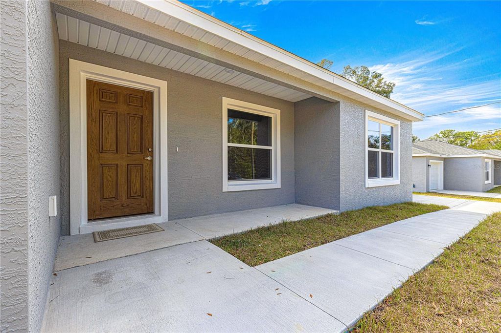 Photo of 46 Guava Pass Terrace, Ocklawaha, FL 32179 (MLS # OM699687)