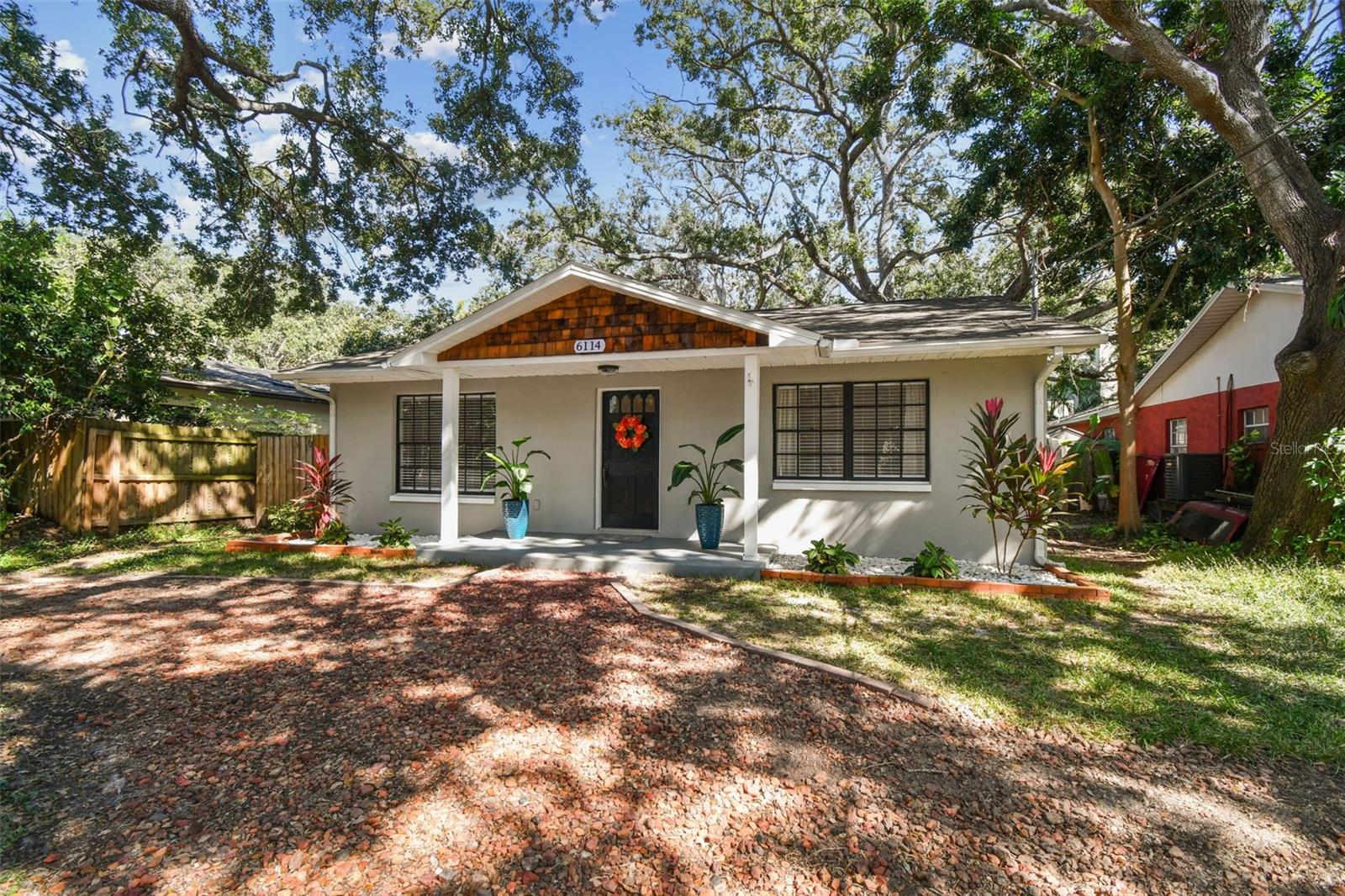 Welcome to 6114 S. Elkins Avenue—a beautifully updated 3-bedroom, 1-bath South Tampa home in the heart of Ballast Point, just steps from Bayshore Boulevard, Ballast Point Park, and Pier, Gadsden Park and MacDill 48. This light-filled residence offers an open floor plan and thoughtful updates throughout, including a 2020 roof, 2025 HVAC, 2021 water heater, new ductwork, 2023 sliding doors, and upgraded lighting. The kitchen features modern shaker cabinetry, stone countertops, stainless appliances, and custom shiplap accents, all flowing seamlessly into the main living area. The third bedroom makes a perfect office or flex space, while the oversized laundry room with newer washer/dryer adds functionality and extra storage. Enjoy true South Tampa curb appeal with a fresh slate-gray exterior, new landscaping, and mature oak trees. The backyard retreat features a turf putting green and patio ideal for entertaining or relaxing outdoors.Located in a prime location minutes to Hyde Park Village, Downtown Tampa, MacDill AFB, and Tampa General, this move-in ready home combines modern comfort, timeless charm, and one of the most desirable locations in all of Tampa Bay.