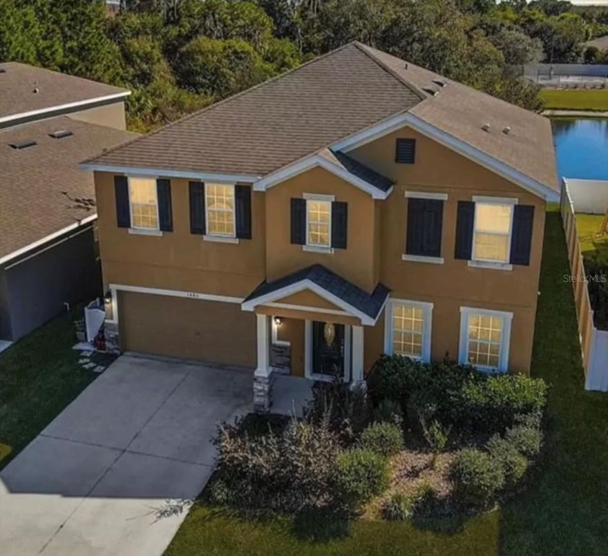 Welcome to Lake Smart Estates - This Beautiful spacious home has had one owner and backs to a pond. This home has tons of upgrades for you to enjoy. The kitchen is spacious and features slab granite with under-mount sink, stainless steel appliances, pantry and breakfast bar. The kitchen opens to the living room with sliding glass door out to your screened in Lani. Also right off of the kitchen is a large formal dining room big enough for all of your get togethers. The first floor also features an office that could be used as the fourth bedroom. Travel upstairs To the open loft which is perfect for a study area, game or theater room... or hang out area for friends and guests. The master suite is large in every way featuring double sinks, soak tub, full tile walk in shower with glass door and large walk-in closet. All bedrooms in your new home are spacious and feature newer floors. The upstairs hall bath also features a double sink and the tub shower combo. Your new home sits right off of 544 with easy access to Highway 27 and I4, it is also located in a neighborhood that features a community pool and access to the chain of lakes. This home is priced to sell and won't last long call us today.