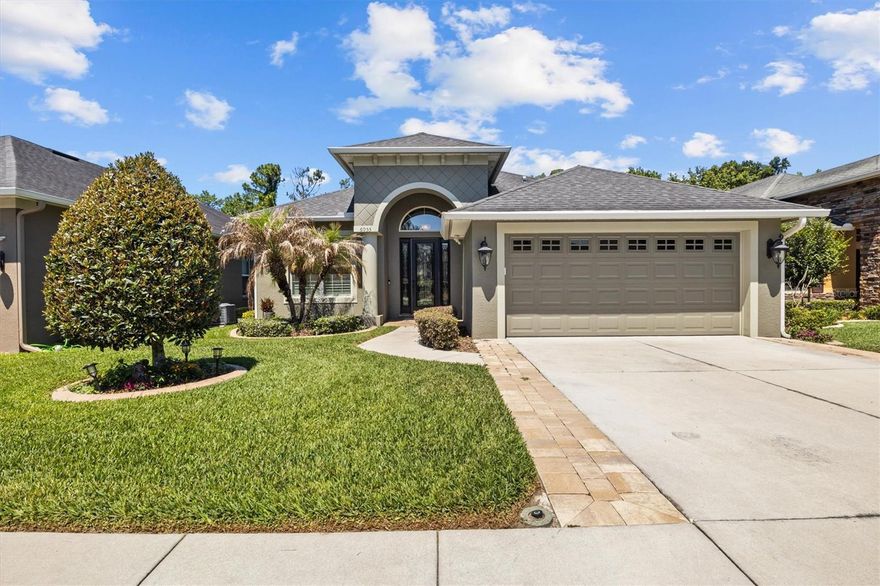 Say goodbye to weekend yard work and welcome true maintenance-free luxury living in South Lakeland! Located in the highly desirable, gated Stoney Creek community, this move-in-ready 3-bedroom, 2-bathroom "Onyx" model by R. Nunez Homes features an additional versatile flex room (with closet) on a premium lot with no backyard neighbors! The low monthly HOA covers it all: complete lawn care, exterior painting every 7 years, community pool, clubhouse and gated entry. Inside, the home boasts upgrades galore: a fully paid-off solar panel system paired with a 2020 Rheem Hybrid Water Heater for ultimate energy savings. Enjoy a whole-house water softener and under-sink reverse osmosis system. The chef's kitchen features granite countertops, solid wood cabinets, a walk-in pantry, and crown molding. 
Relax in your private backyard oasis featuring a solar-heated, salt-water pool with an expansive entertaining deck; cage lighting and exterior television with storm cover included for entertaining into the night!!!! Upgrades include wood-look tile, tray ceilings, a massive primary suite walk-in closet, custom gutters, and manicured landscaping. Perfectly situated between Tampa and Orlando with quick access to the Polk Parkway. Enjoy ultimate convenience being just minutes from top-rated grocery stores, dining, local lakes, and parks. Schedule a tour today!!