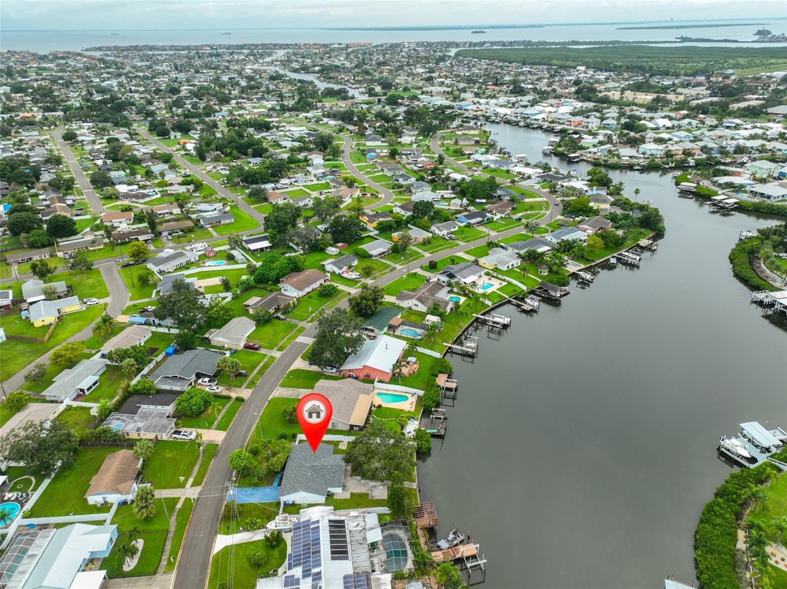 Experience the ultimate waterfront lifestyle in this beautifully remodeled Apollo Beach rental home on a deep-water canal! Enjoy stunning water views from almost every room, launch your kayaks right from the backyard, and bring your water toys. Inside, the bright and open layout features a modern kitchen with stainless steel appliances and stylish stone countertops. A breakfast nook sits just off the kitchen, and the living room/dining room combo flows into a separate great room perfect for relaxing or entertaining all with amazing water views. Step outside to a spacious backyard where you can fish right off the property and enjoy watching manatees, dolphins, and even schools of mullet jumping from the water. Natural light fills the home, highlighting the serene waterfront setting. Additional features include a 2-car garage and a non-HOA community. Conveniently located with easy access to Tampa, Bradenton, St. Pete, and Sarasota.