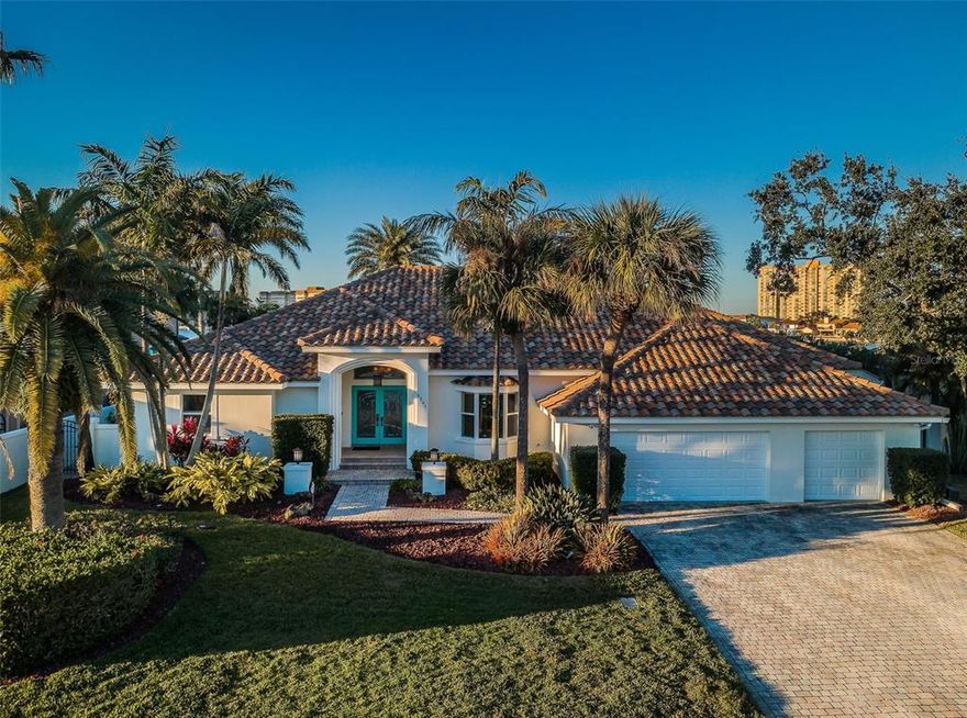 LOCATED IN ONE OF THE BEST BOATING COMMUNITIES IN FLORIDA, THIS SPACIOUS, SINGLE-LEVEL 4 BEDROOM 3 BATH RESIDENCE IS THE ESSENCE OF ELEGENCE AND COASTAL CONTEMPORARY CHIC! A lovely curb appeal with a fine covered double door entry welcomes you to a home of beauty, style and sophistication – with an open floorplan that is purposefully built and thoughtfully designed to deliver a uniquely cosmopolitan feel. Step into the elegant foyer and you’ll be immediately captivated by the spectacular waterfront. Take in the gorgeous water-facing living room and its one-of-a-kind, built-in luxury bar with separate beverage and wine chillers. The lavish, open-concept, gourmet kitchen boasts superbly-designed Alderwood cabinetry with “white bamboo” granite surfaces, a magnificent multi-level breakfast bar, gas cooking, stainless steel appliances and a striking glass-tile backsplash. Graceful formal dining is complemented by a fine casual dining area adjacent to the pool deck. Overlooking the waterfront, the huge family room features a lovely fireplace with flat-stone façade and matching built-in storage benches. The posh, waterfront owner’s suite enjoys gorgeous distressed cherrywood flooring and a sizable dedicated sitting area that opens to the pool deck. The owner’s bath is a luxurious, pampering delight - with impressive use of cherrywood/granite, triple vanities, remarkable tilework, a jetted spa tub and a fine glass shower enclosure with intricate lattice tilework. You’ll love the grand walk-in owner’s closet with cherrywood closet system. 2nd waterfront bedroom, with a luxurious adjoining full bath, makes for an ideal guest bedroom suite. Bedrooms 3 and 4 are surprisingly large and tastefully finished, and the 3rd full guest bath is well-appointed. Through pocketing sliding glass doors, you’ll discover a stunning 26ft-wide covered travertine-paver entertainment deck with commanding views of the waterfront. Dazzling pebble-sheen pool and hot tub are supported by numerous seating/lounging areas, and a terrific built-in outdoor gas cooking center and bar area overlooking the water. Large composite deep-water dock with boat lift provides rapid access to the Gulf. Many, many updates/upgrades with outstanding quality of workmanship! The best commuting waterfront location in Tampa Bay. Close to I275, reach the beaches in 4 min, downtown St. Pete in 10 min and Tampa Airport in 25 min. An exceptional luxury value in a premier location! Buyer to verify dimensions.