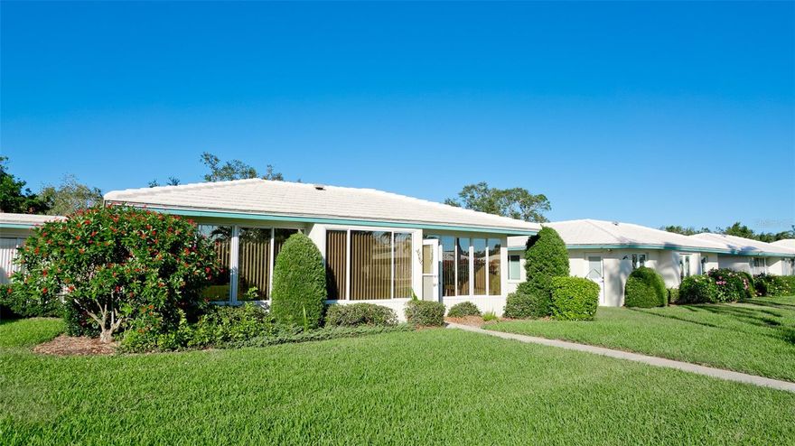 Welcome to your dream retreat in the coveted Village Green 55+ community of Bradenton, Florida! This beautifully maintained 2-bedroom, 2-bathroom residence with a versatile bonus room and 2-car garage offers 1,825 square feet of thoughtfully designed living space, perfectly balancing comfort, functionality, and style.
Step inside to discover a bright, open-concept living area that flows seamlessly into the dining room, kitchen, and bonus room—ideal for both everyday living and entertaining. The spacious kitchen provides convenient access to the laundry room and garage, making daily routines effortless. The primary suite offers a tranquil escape with a private bath and generous closet space, while the second bedroom adapts beautifully as a guest room, home office, or creative studio. A well-appointed second bathroom adds thoughtful convenience for family and visitors alike.
One of the home’s standout features is the fully enclosed porch, designed as the perfect Florida room. Bathed in natural light and offering year-round comfort, this inviting space is ideal for morning coffee, afternoon reading, or evening gatherings with friends. It extends the living area while capturing the essence of Florida’s indoor-outdoor lifestyle.
From the back entrance, you’re just moments away from the neighborhood pool, walking paths, and shuffleboard courts—all less than a minute’s stroll. Life in Village Green means enjoying expansive green spaces and a peaceful atmosphere, while still being close to Bradenton’s pristine beaches, vibrant shopping, dining, and entertainment.
This home is more than a place to live—it’s a lifestyle. Imagine morning walks under the Florida sun, afternoons by the pool, and evenings entertaining in your spacious living room or relaxing in your Florida room. Don’t miss your chance to own a piece of paradise in one of Bradenton’s most desirable neighborhoods. Schedule your private showing today!