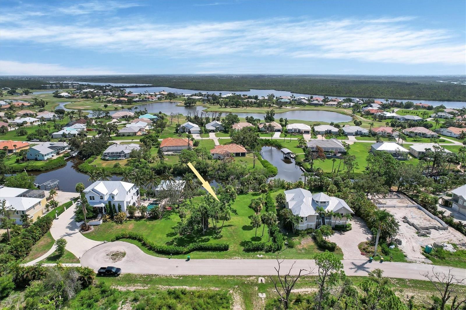 Large waterfront lot with approximately 102 ft of water frontage along the Amberjack Waterway which leads to Coral Creek, the ICW and Gulf of Mexico! Located within the gated and deed restricted community of Coral Cove with only 25 single family lots, this quiet and peaceful location is surrounded by nature. Take your kayak, stand up paddleboard or boat out from your private dock into the magical waters of Coral Creek and the ICW in minutes. The Seller has also installed new 3ft x 6ft large size rip rap along the lot’s entire waterfront. As a bonus, there is a full set of engineered plans for two new boat slips with two 8,000 lb lifts under a hard cover with common dock. Sidewalks adjacent to the front gate allow for easy and safe walking and biking, with access to the 7-mile Pioneer Trail. Located in Placida, Fl, this property is only 2 miles to the beaches, shops and restaurants in Boca Grande. Close by are numerous private and public golf courses.