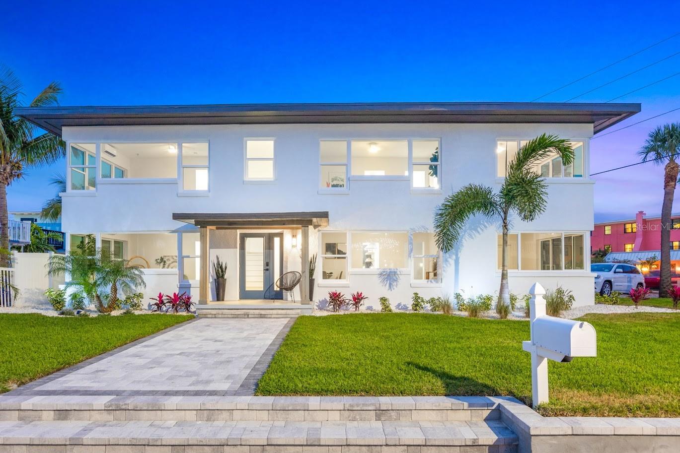 Undamaged by the 2024 hurricanes, this exceptional St. Pete Beach property offers peace of mind and premium coastal living—where luxury, flexibility, and location come together just 150 yards from the Gulf of Mexico. Whether you're looking for a spacious single-family retreat, a multi-generational home, or an income-producing investment, this fully renovated corner-lot property offers endless potential just steps from the sand. Currently configured as four beautifully updated units, the layout includes two 1-bedroom and two 2-bedroom spaces—each with private entry points—making it ideal for large families, visiting guests, or future reconfiguration into one expansive home. Less than 150 yards from the pristine Gulf shoreline, where sugar-soft sands and iconic sunsets await, this vibrant yet tranquil neighborhood is just a short walk or bike ride from the shops, restaurants, and live entertainment of historic Corey Avenue. Outside, the lush tropical landscaping, artificial turf, and xeriscaping create an inviting low-maintenance yard. The private patio and open-air gathering areas are perfect for entertaining or relaxing after a day at the beach. A dedicated storage building provides room for kayaks, beach gear, and more. Inside, each living space is thoughtfully upgraded with luxury vinyl plank flooring, impact-rated windows, spa-like bathrooms with frameless glass showers, and stylish kitchens featuring brand-new stainless steel appliances. Mini-split AC systems, in-unit washer/dryers, and generous closet space make every unit comfortable and functional. Major systems have all been replaced for peace of mind: new plumbing, updated electrical, full insulation, and a brand-new 2024 roof. Each unit also has its own tankless water heater for energy-efficient living. Whether you're dreaming of a spacious single-family beach home, a private retreat with room for extended family, or a property that earns income when you're not there, this rare St. Pete Beach gem delivers. *The 2024 hurricanes have not affected this property!