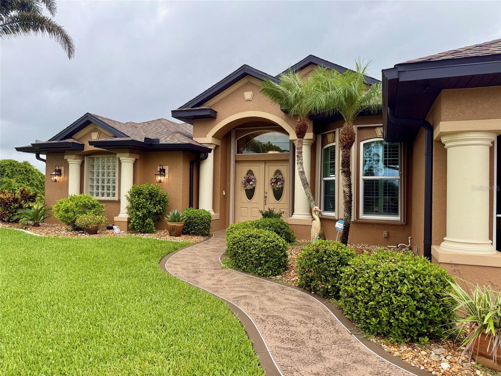 Completely Remodeled Waterfront Home with Extra Lot & Premium Features
Discover the perfect blend of comfort, style, and peace of mind in this beautifully remodeled 3-bedroom, 2-bathroom waterfront home with a 3-car garage, offering nearly 2,200 sqft of living space. Nestled in a serene tropical setting, this property includes an additional lot, providing extra space to relax, entertain, or expand.
From the moment you arrive, you’ll be impressed by the mature landscaping, elegant architectural columns, and multi-dimensional roofline that enhance the home’s curb appeal. Step inside to find soaring vaulted and tray ceilings, custom window treatments, including Plantation shutters, and stylish finishes throughout.
The heart of the home is the remodeled kitchen (2020), featuring dual closet pantries, abundant cabinetry, and a spacious breakfast nook with picturesque views of the screened-in pool area. Adjacent to the kitchen, the formal dining room offers natural light and views of the front yard.
The expansive primary suite is a private retreat, complete with a large walk-in closet, and a luxurious ensuite bathroom boasting a huge walk-in shower, double vanity, and fog-resistant mirrors. On the opposite side of the home, Bedrooms 2 and 3 offer privacy for family or guests and share the updated second bathroom (2023).
Multiple living areas enhance the home’s functionality and flow — both the living and family rooms feature sliding glass doors that open to the pool deck, while the family room also offers canal views from a large window.
Extensive upgrades provide lasting value and peace of mind:
• New Roof (2022)
• New A/C System (2021)
• Accordion Hurricane Shutters (2024)
• New Windows (2021)
• Water Treatment System (2021)
• Water Heater (2022)
• New Washer & Dishwasher (2025)
• Ceramic Plank Tile Flooring (2022) – No Carpet!
• Freshly Painted Interior (2024)
• Decorative Driveway Finish (2025)
This move-in-ready home combines modern upgrades, spacious indoor and outdoor living areas, and tranquil waterfront views. Whether you're looking to entertain, relax, or simply enjoy the Florida lifestyle, this home has it all.
Rotonda West, known for its golfing community comprising five courses with 99 holes catering to all skill levels, is nestled within the Cape Haze peninsula. This picturesque location seamlessly combines nature with proximity to charming restaurants and boutiques. Nearby, two community parks offering recreational amenities such as tennis courts and playgrounds. Residents enjoy convenient access to the Gulf and its pristine beaches, including Englewood Beach, Manasota Key, and the beautiful Boca Grande. Outdoor enthusiasts will enjoy many of the recreational activities available, from the 8-mile Cape Haze Pioneer Trail, to boating and fishing to exploring the historic charm of Downtown Englewood's Dearborn Street, filled with shops and cultural offerings.
Schedule your private showing today!