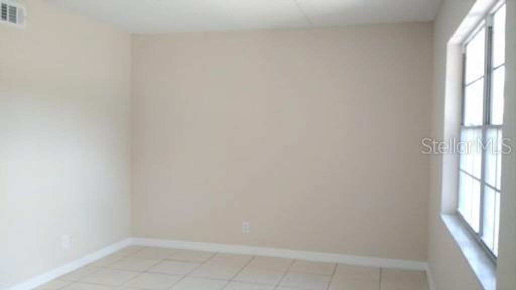 Photo of 302 S Spring Garden Avenue #A06, Deland, FL 32720 (MLS # O6400985)